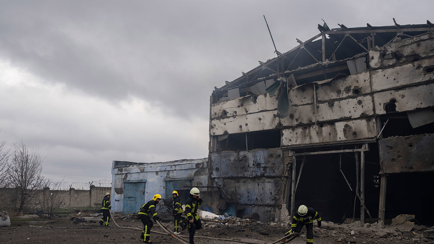 Firefighters try to extinguish the fire at a damaged factory following a Russian bombing in Kramatorsk, Ukraine, Thursday, April 14, 2022.