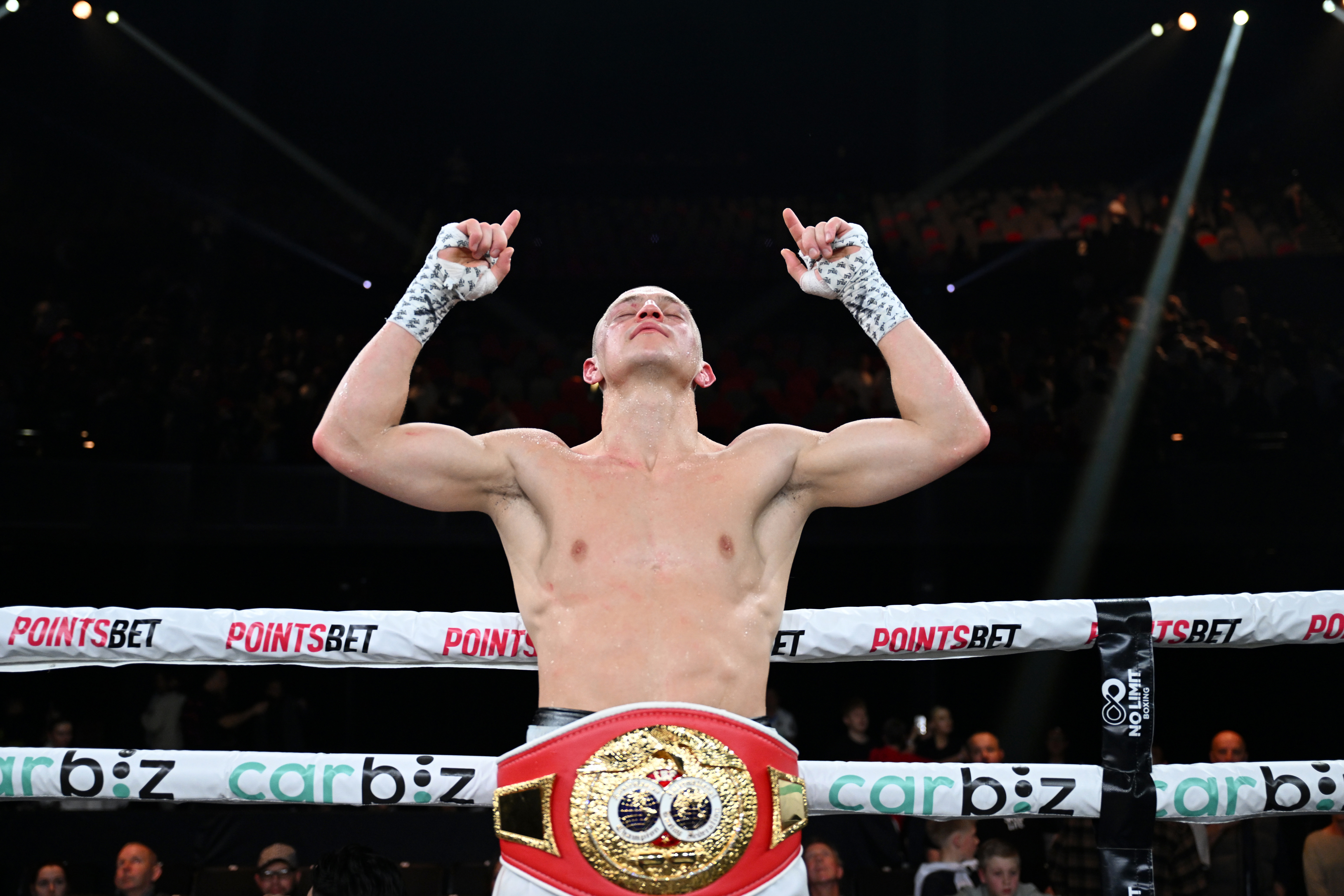 Nikita Tszyu celebrates his super welterweight titles.