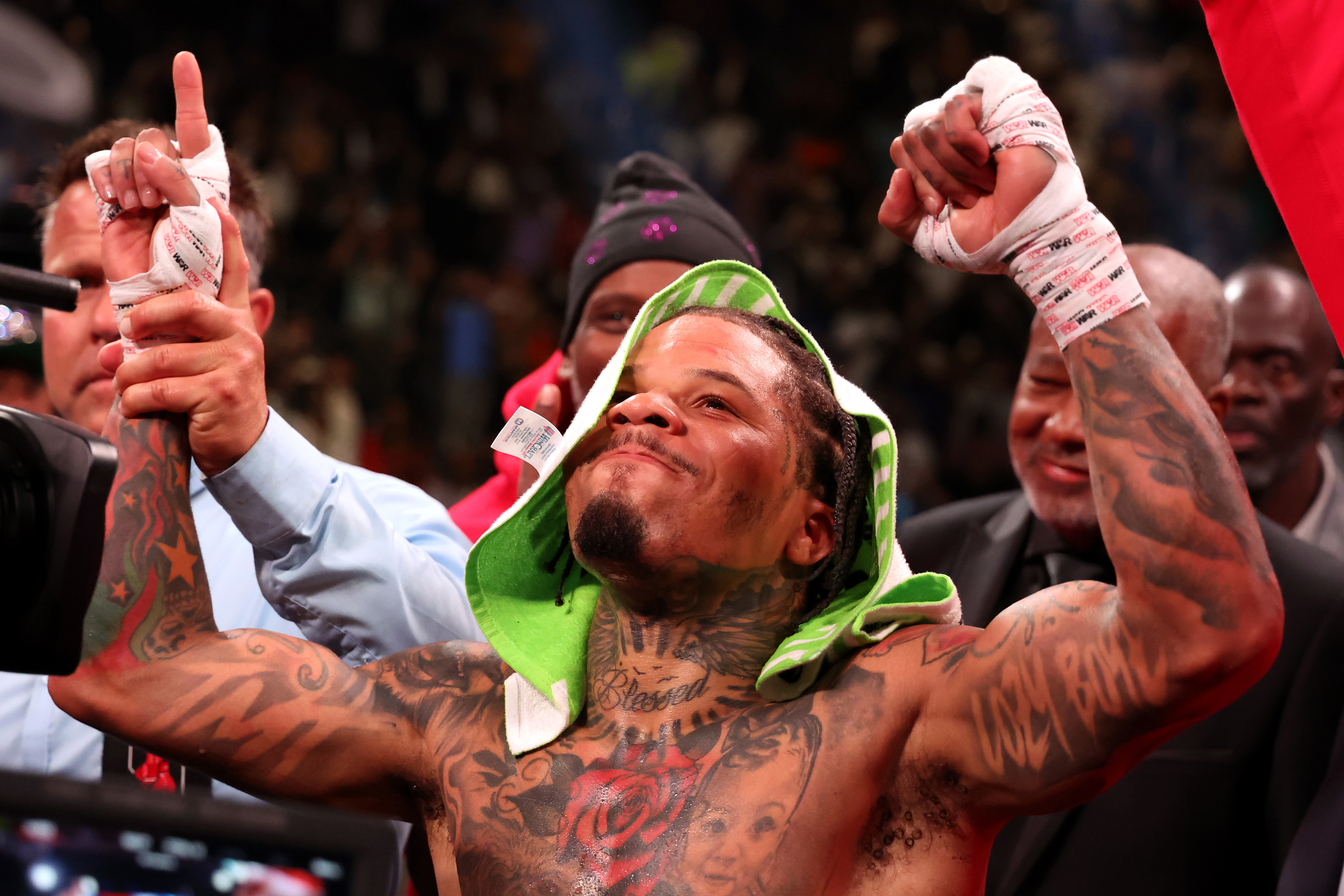 Gervonta Davis in the green and purple trunks reacts after defeating Ryan Garcia in the black trunks by knockout in the seventh round during their catchweight bout.