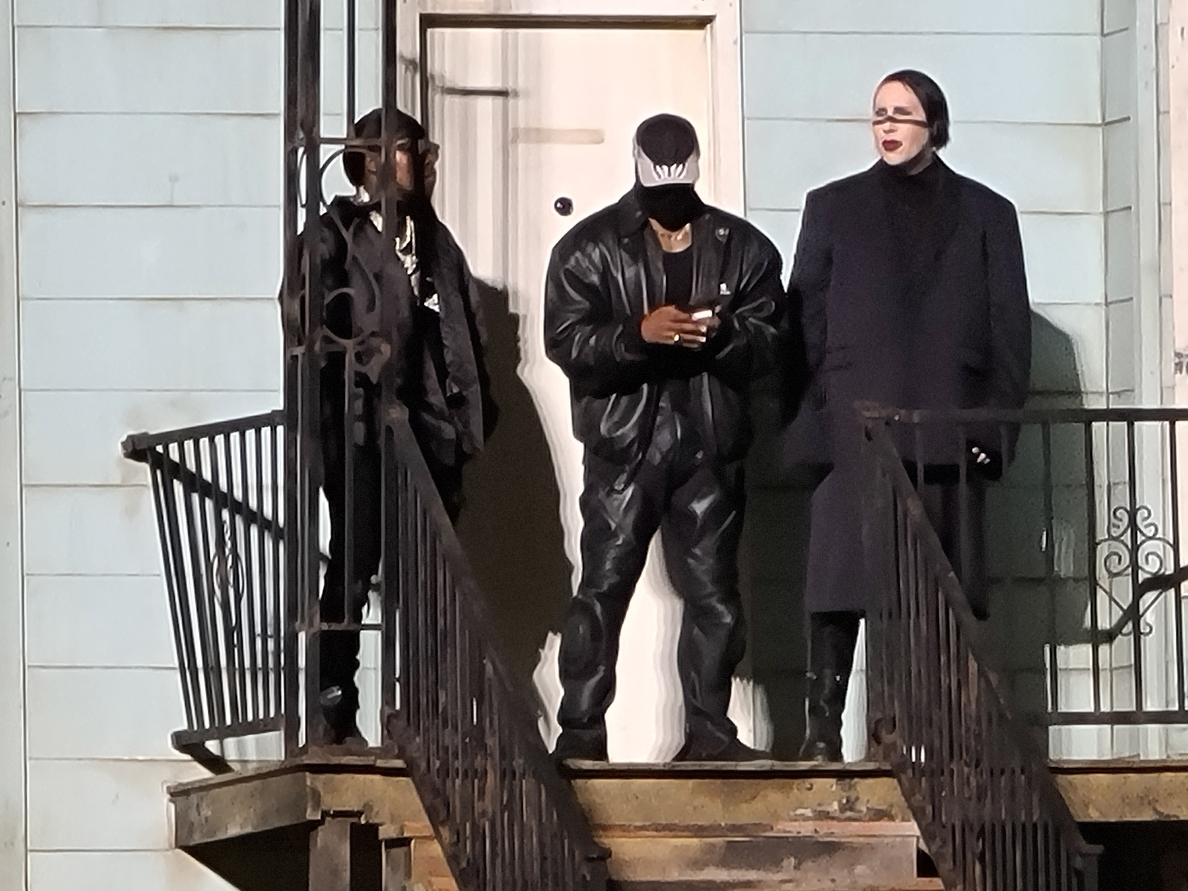 From left to right: DaBaby, Kanye West and Marilyn Manson during the Donda event on August 26, 2021 in Chicago, Illinois. 