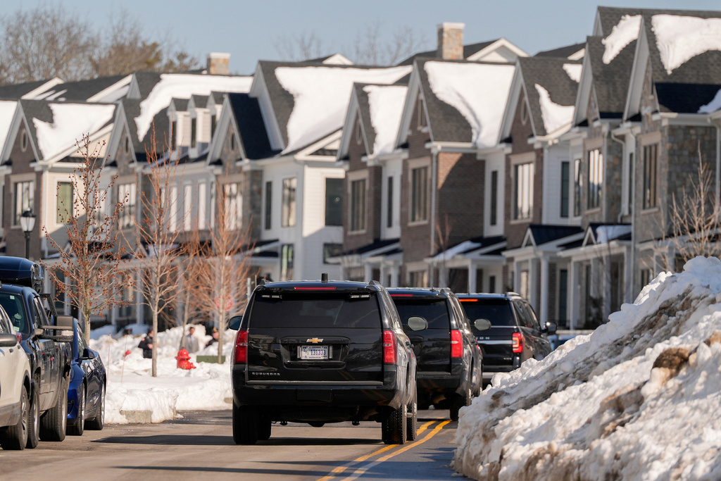 A motorcade carrying former US Secretary of State Hillary Clinton 