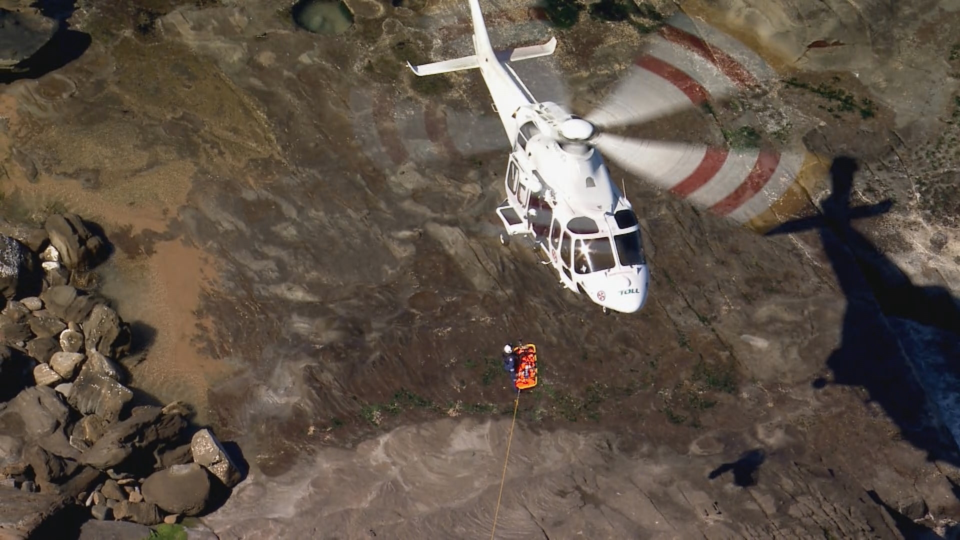 A woman has been rescued after being swept onto the rocks at Stanwell Park.