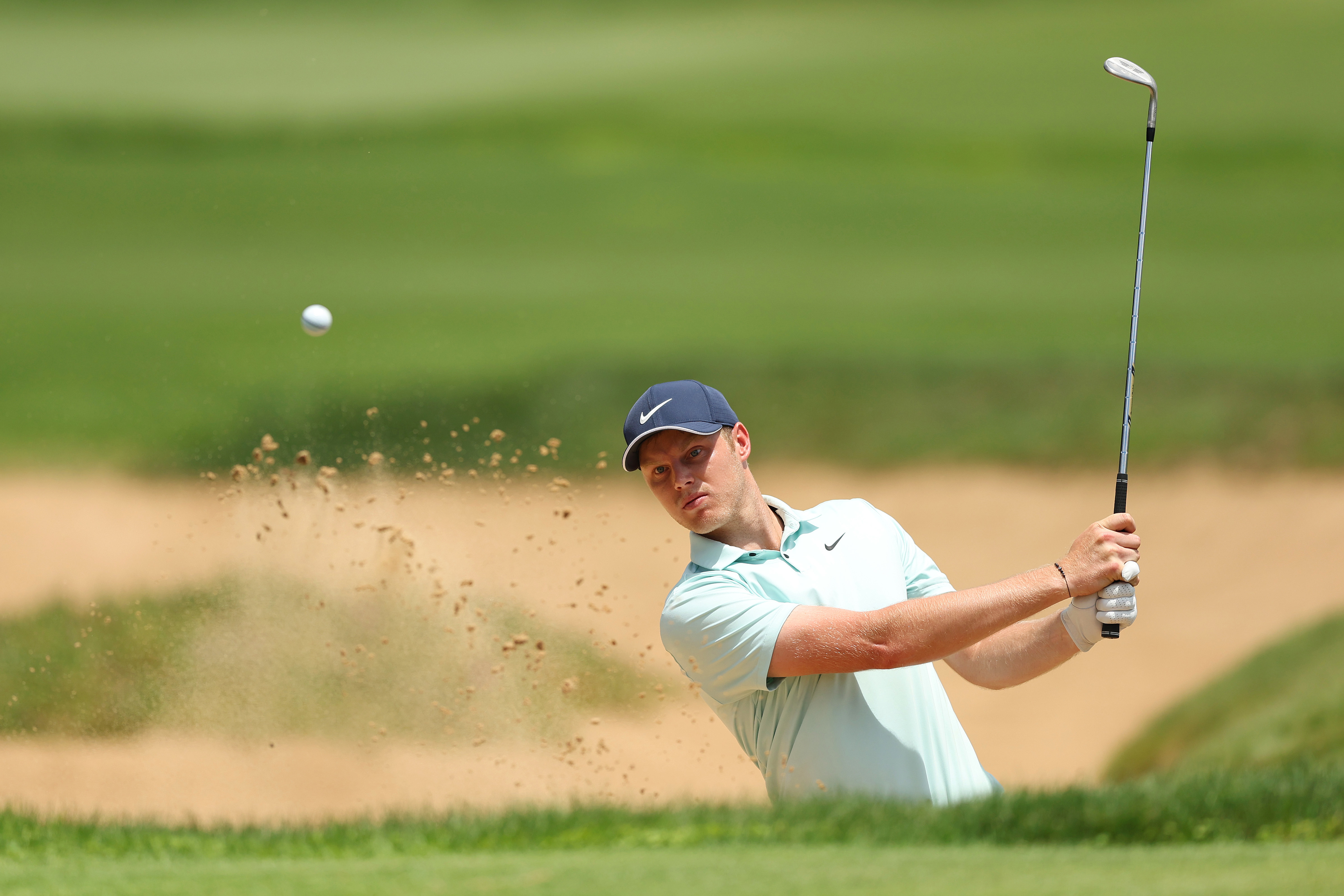 Cameron Davis of Australia plays a shot from the bunker.
