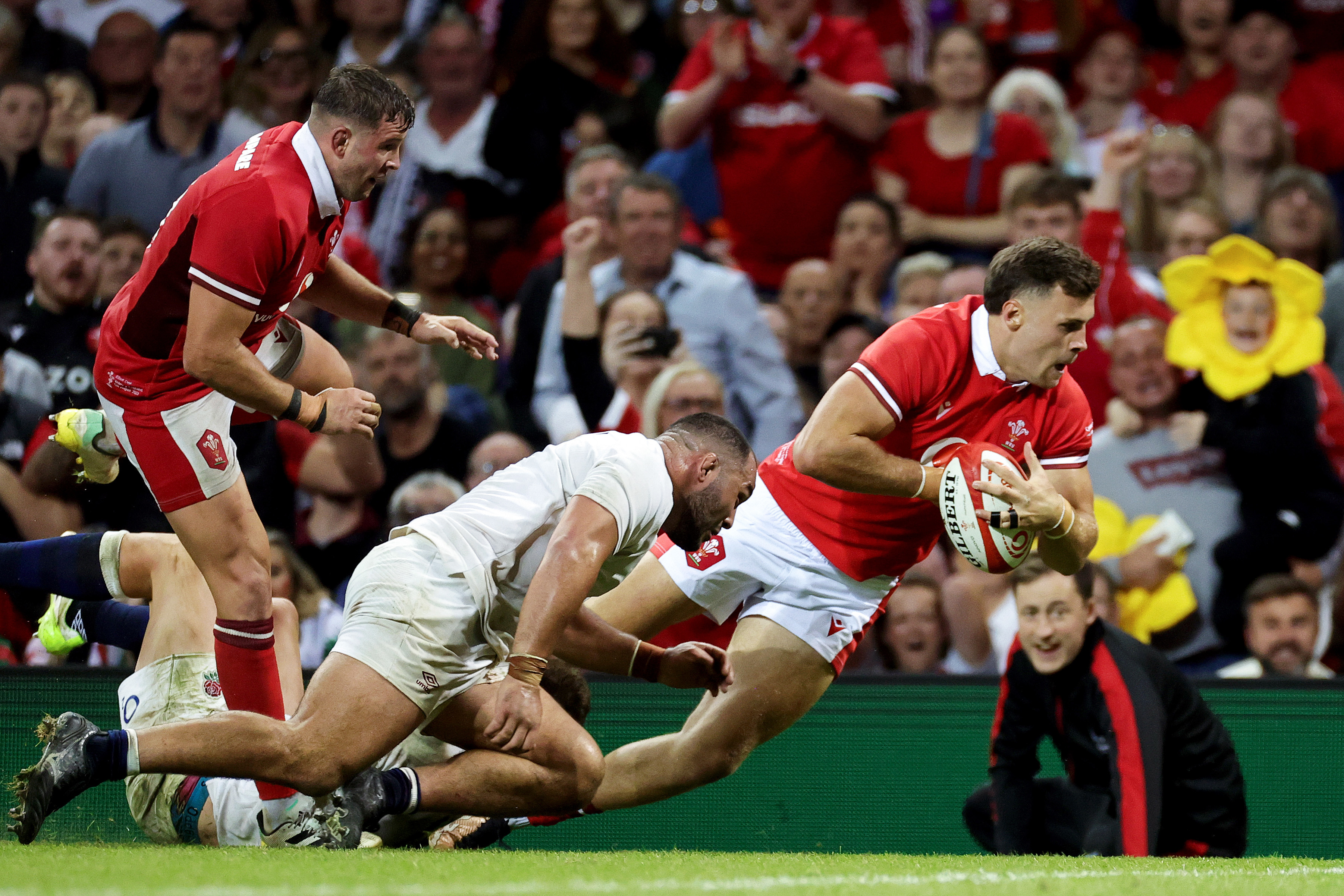 Mason Grady of Wales is tackled by Ellis Genge of England at Principality Stadium in Cardiff, Wales.