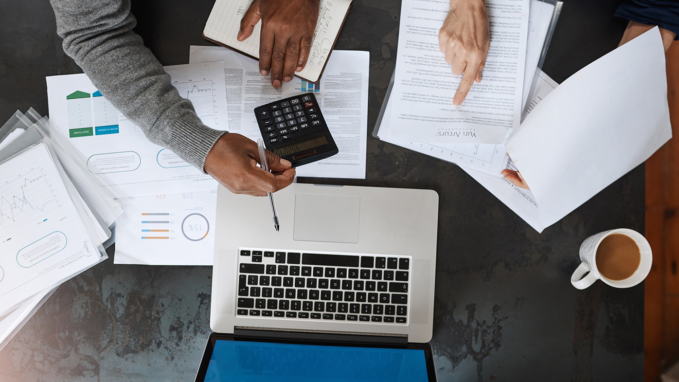 Superannuation crunching numbers laptop calculator doing finances tax return