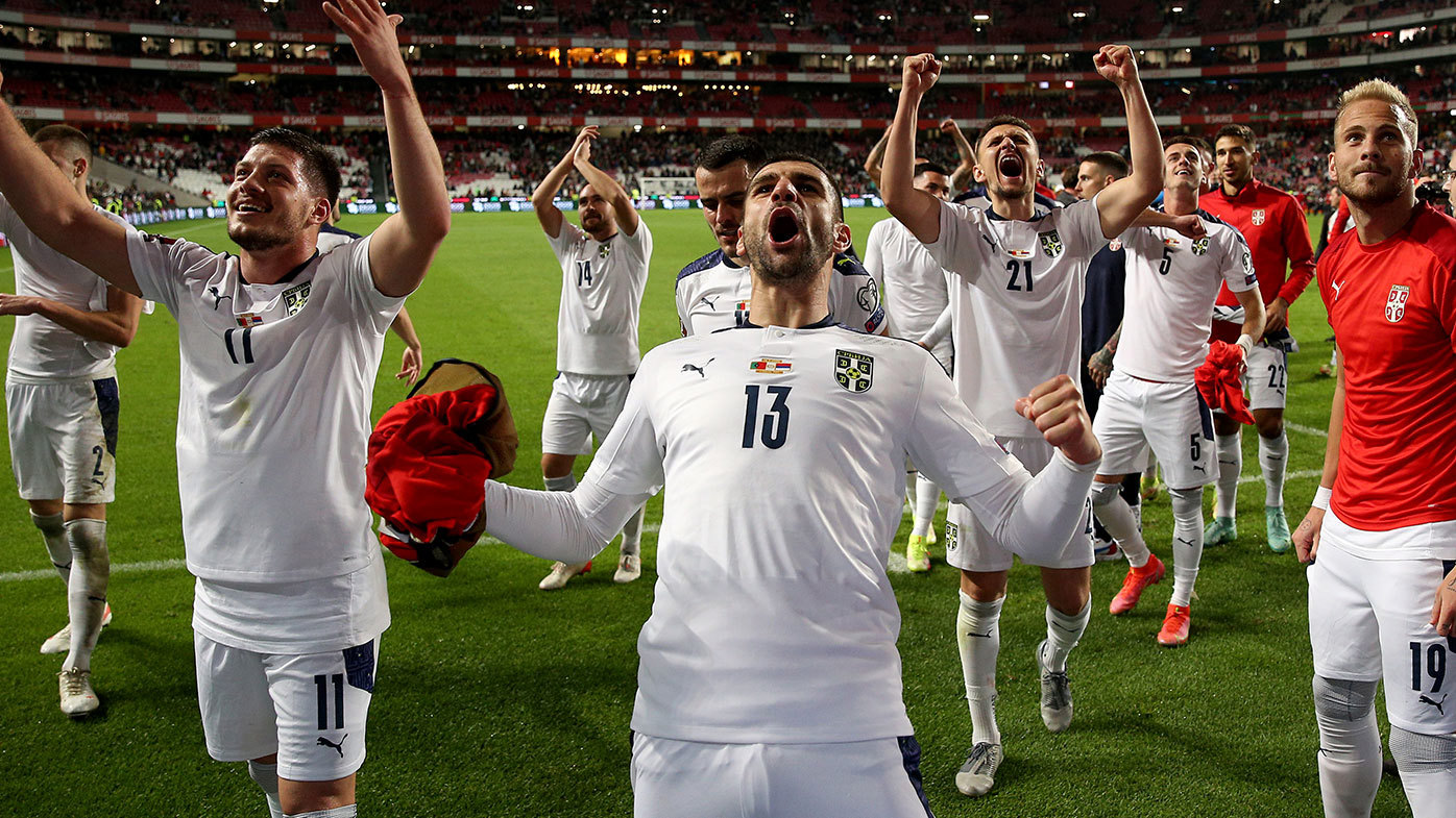 Serbia's team players celebrate the victory 