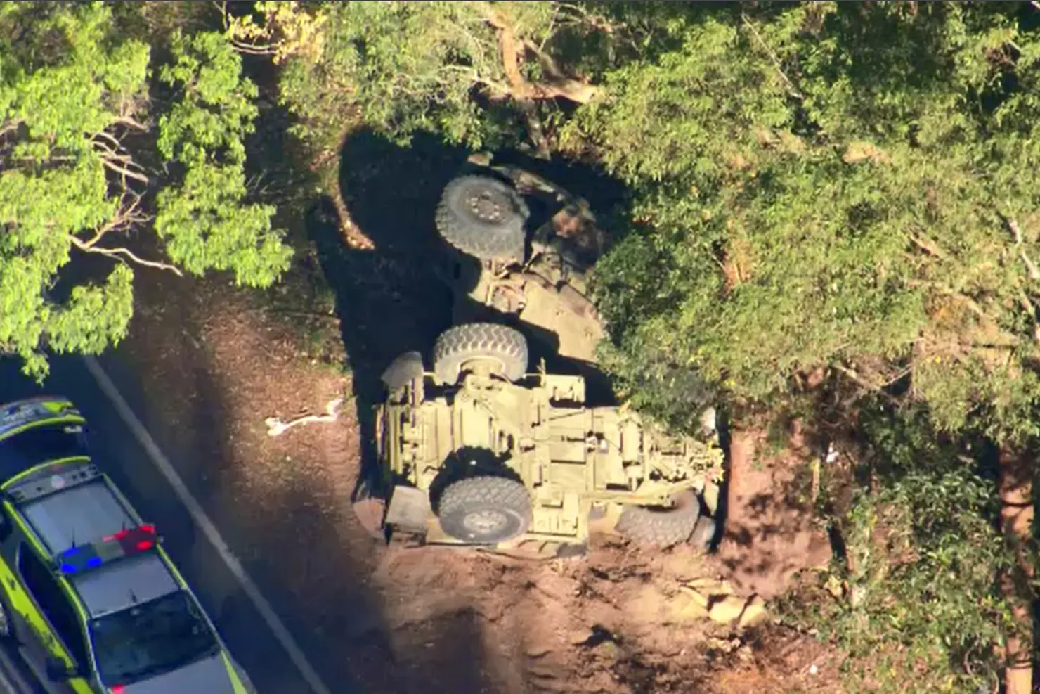 The force of the smash caused the truck to roll onto its roof, yet ﻿all defence personnel escaped without physical injury.