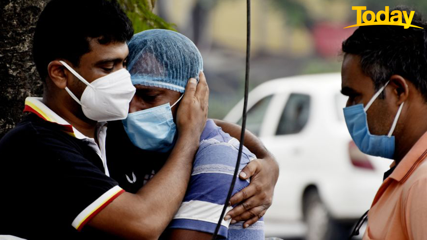 A family member of a deceased COVID-19 patient breakdown outside a government hospital in Kolkata, India. (Photo by Indranil Aditya/NurPhoto via Getty Images)