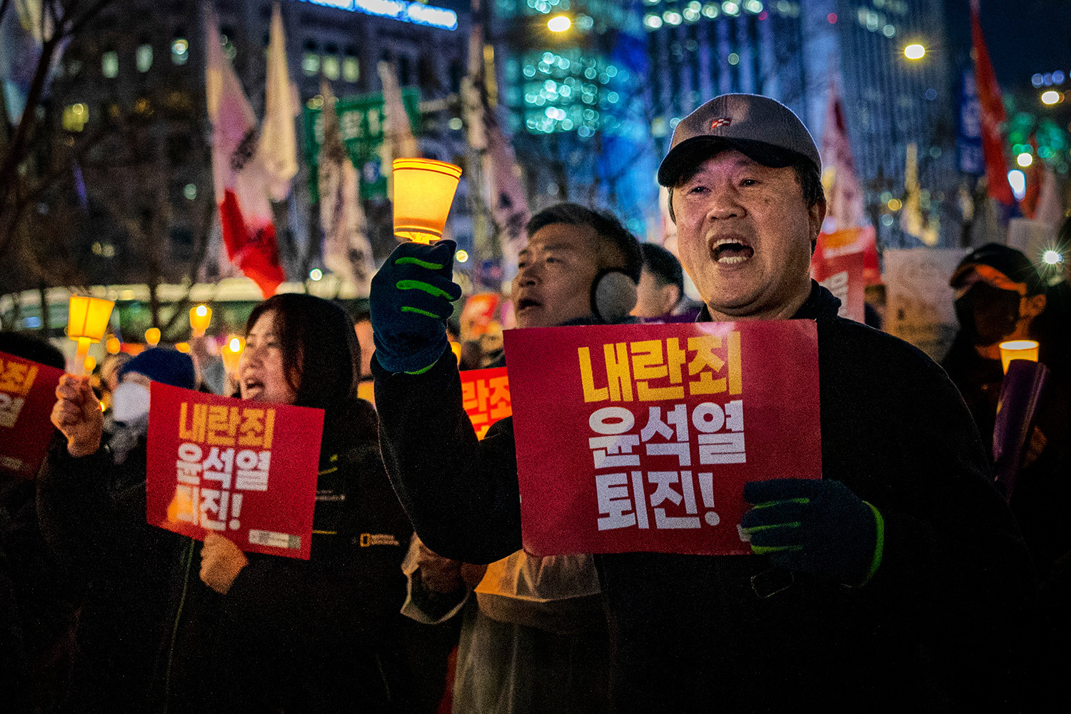 Protesters march to the presidential office after a candlelight vigil against South Korean President Yoon Suk Yeol in Seoul, South Korea on Thursday, December 5, 2024.