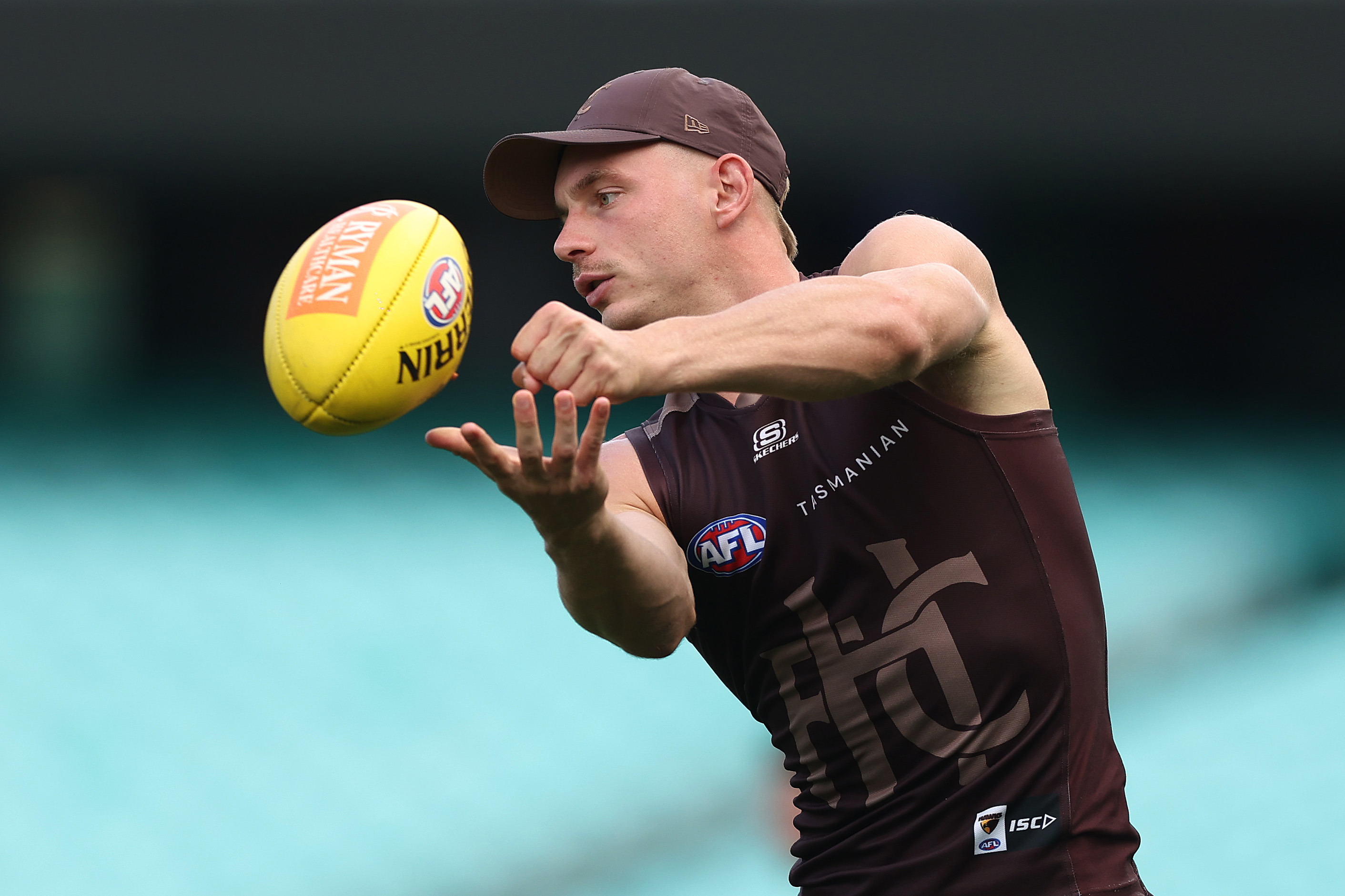 James Worpel of the Hawks handpasses during a Hawthorn Hawks AFL training