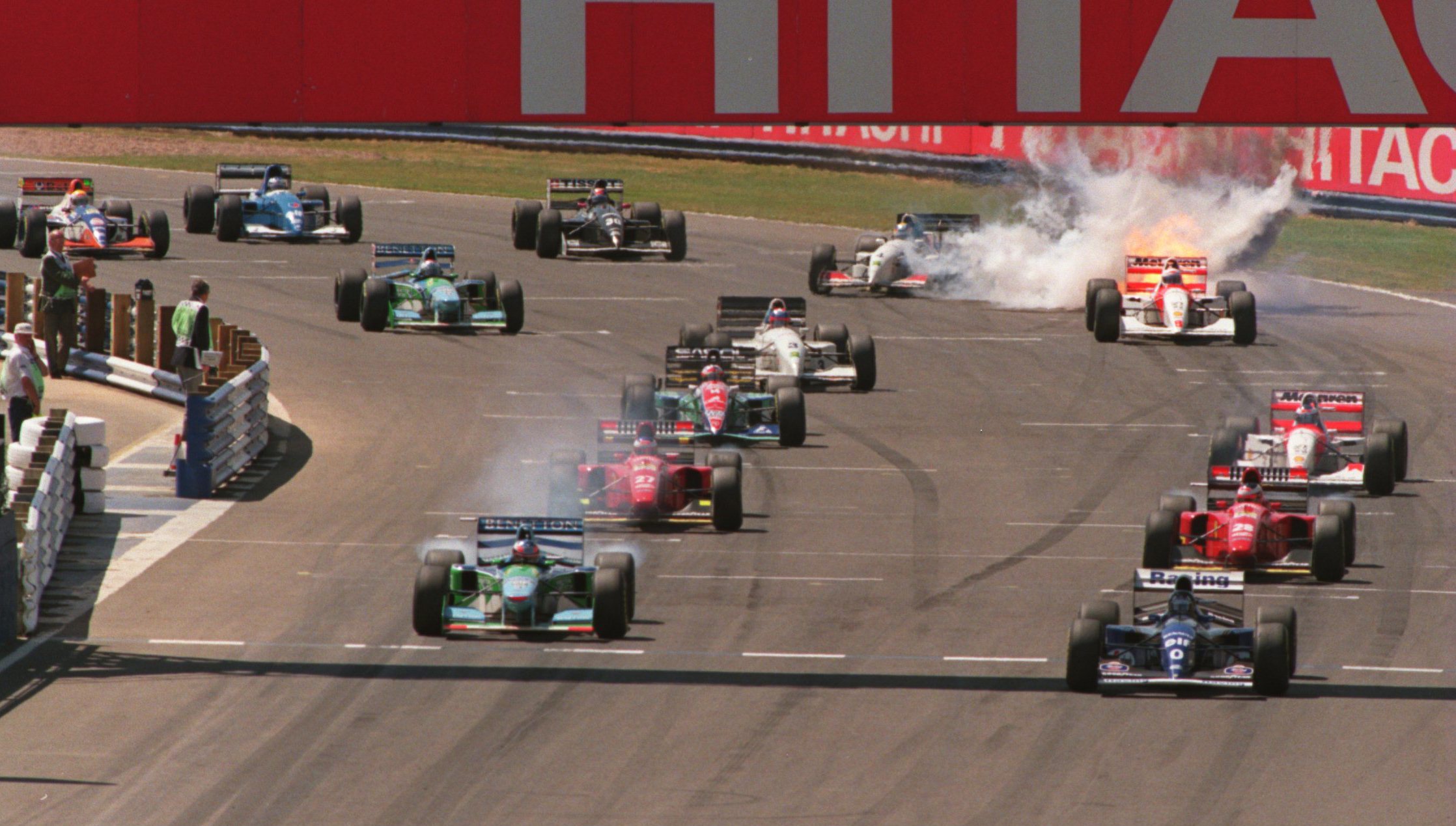 Martin Brundle's Peugeot-powered McLaren MP4/9 bursts into flames at the start of the 1994 British Grand Prix. 