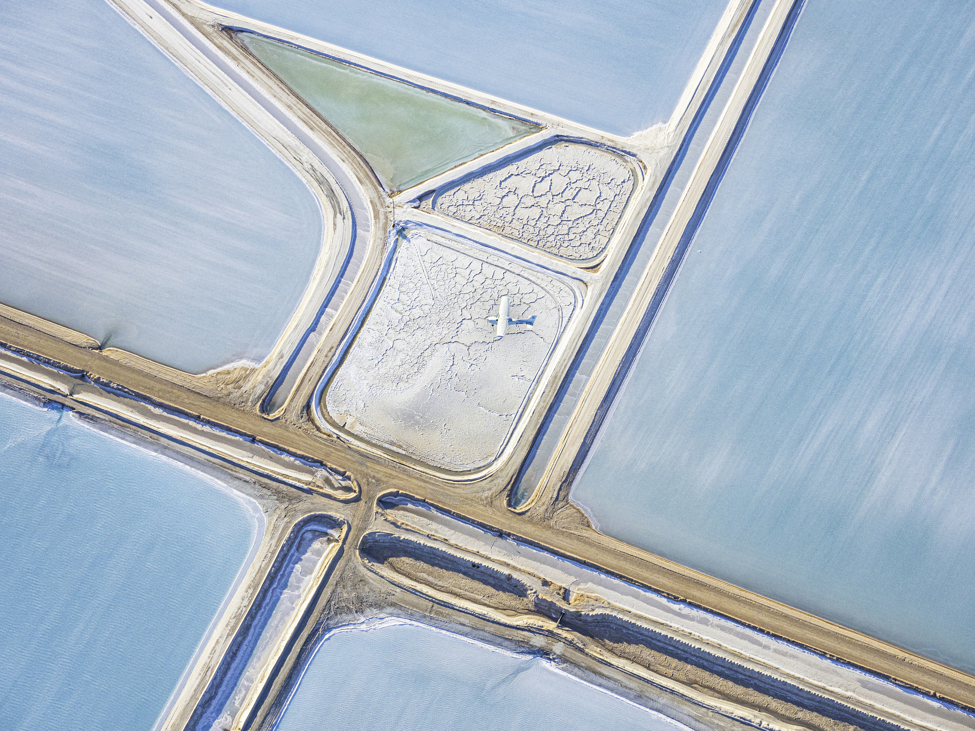 Aerial photo taken from a small plane showing a salt works and salt working Useless Loop, Shark Bay, Western Australia