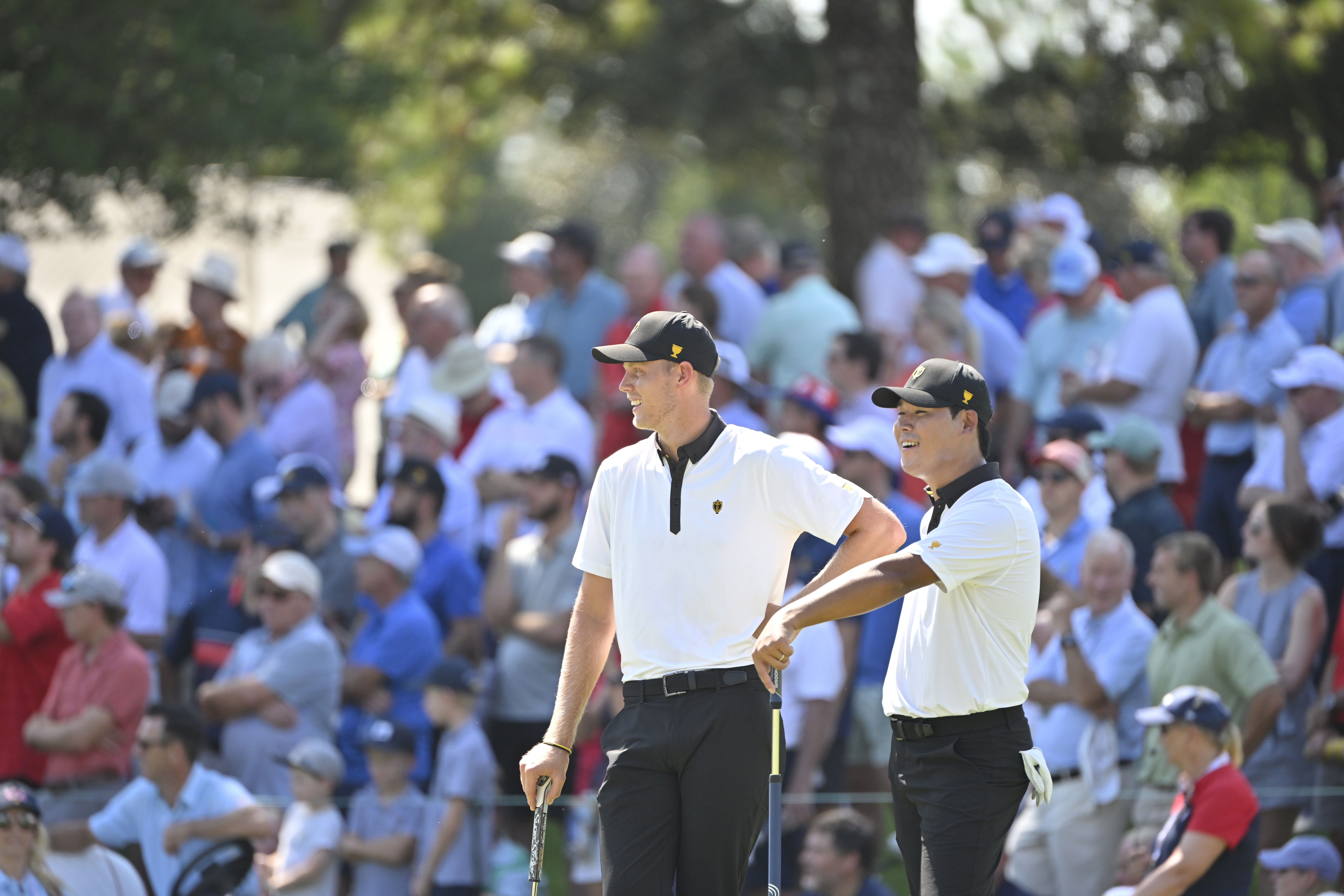 International Team members Si Woo Kim of South Korea and Cam Davis of Australia are seen on the second green  during the first round of Presidents Cup at Quail Hollow September 22, 2022, in Charlotte, North Carolina. (Photo by Ben Jared/PGA TOUR via Getty Images)