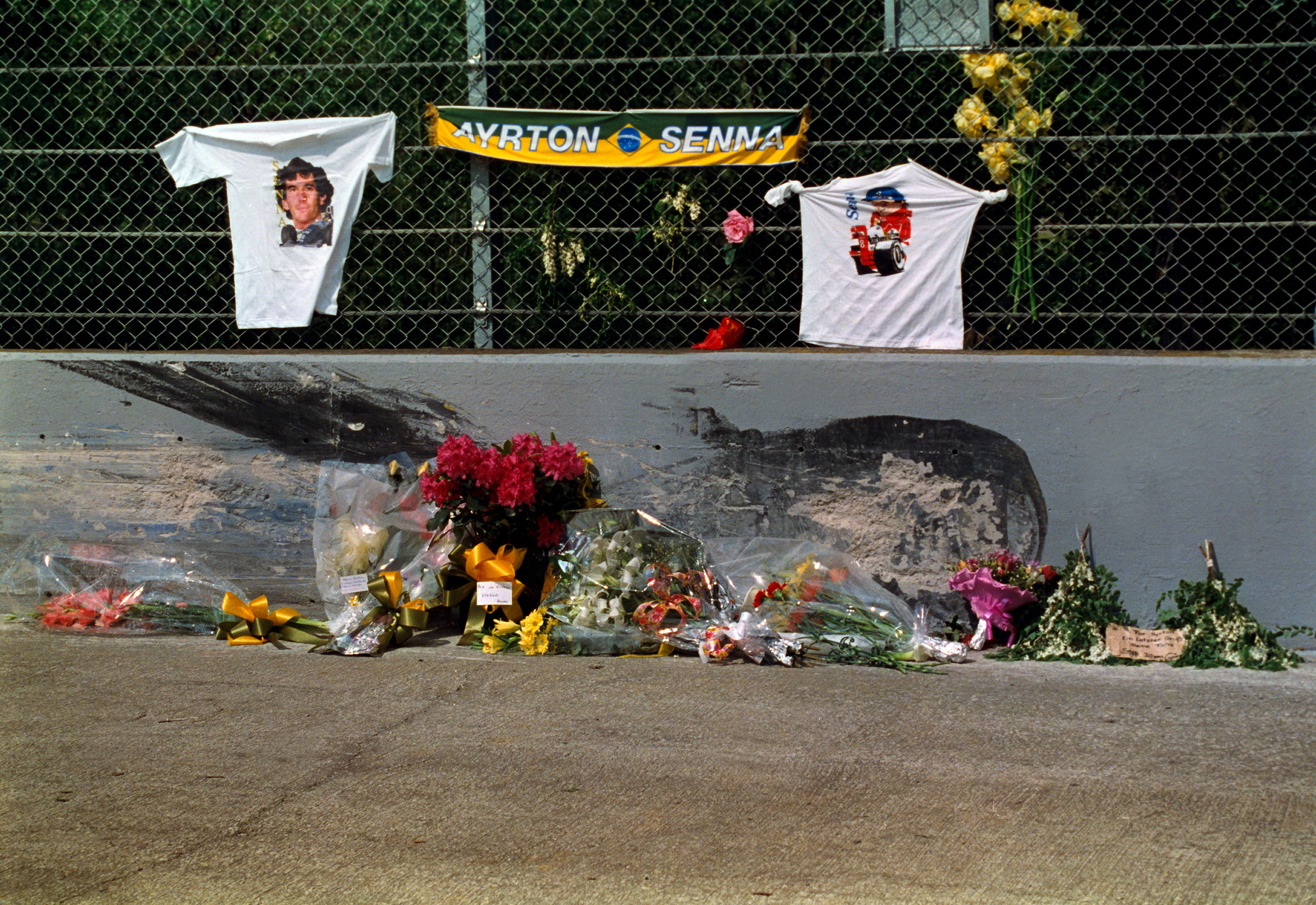 Memorials at the crash site following the death of Ayrton Senna.