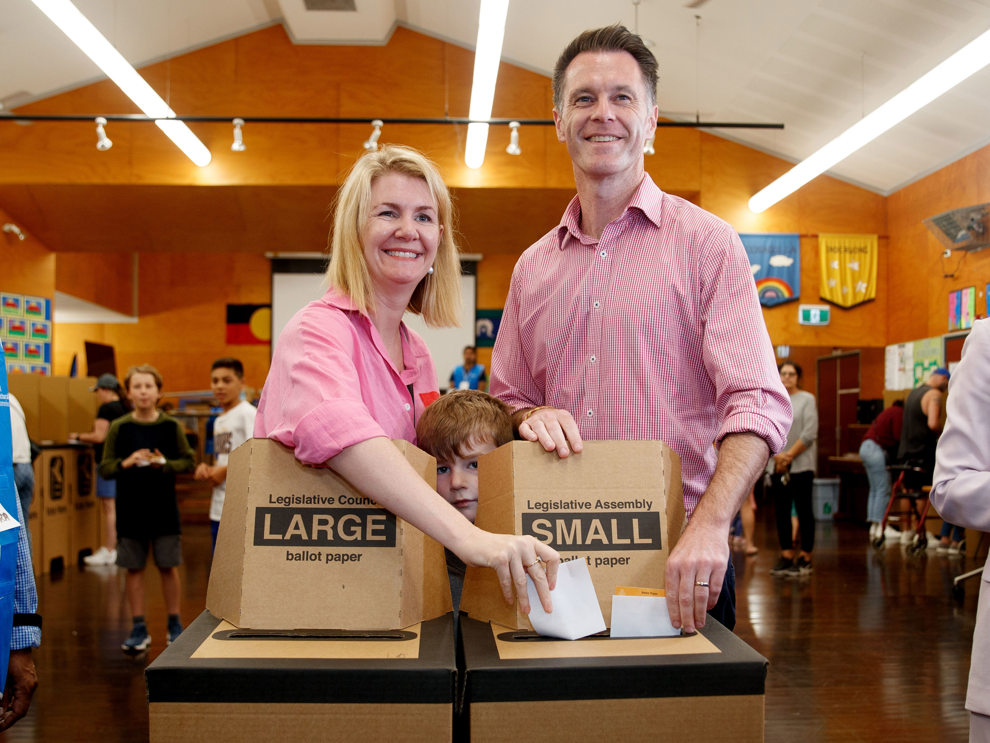 Chris Minns joins his wife Anna and children to cast their vote