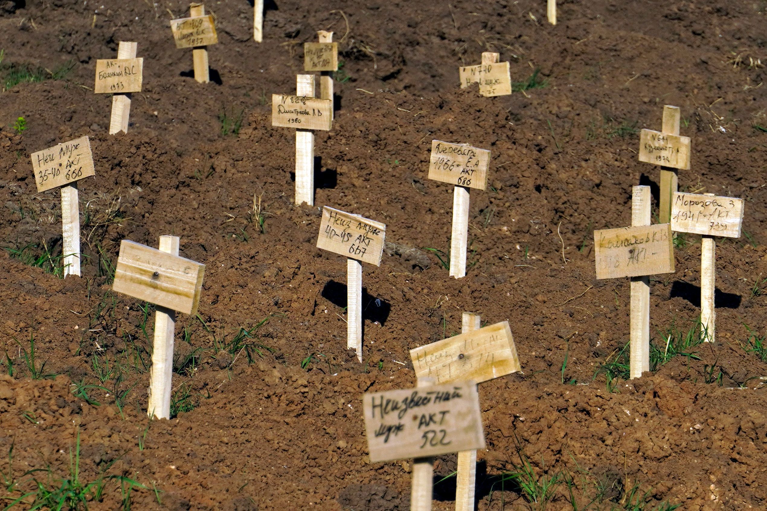 Fresh graves are seen at a cemetery in the Ukrainian city of Mariupol.