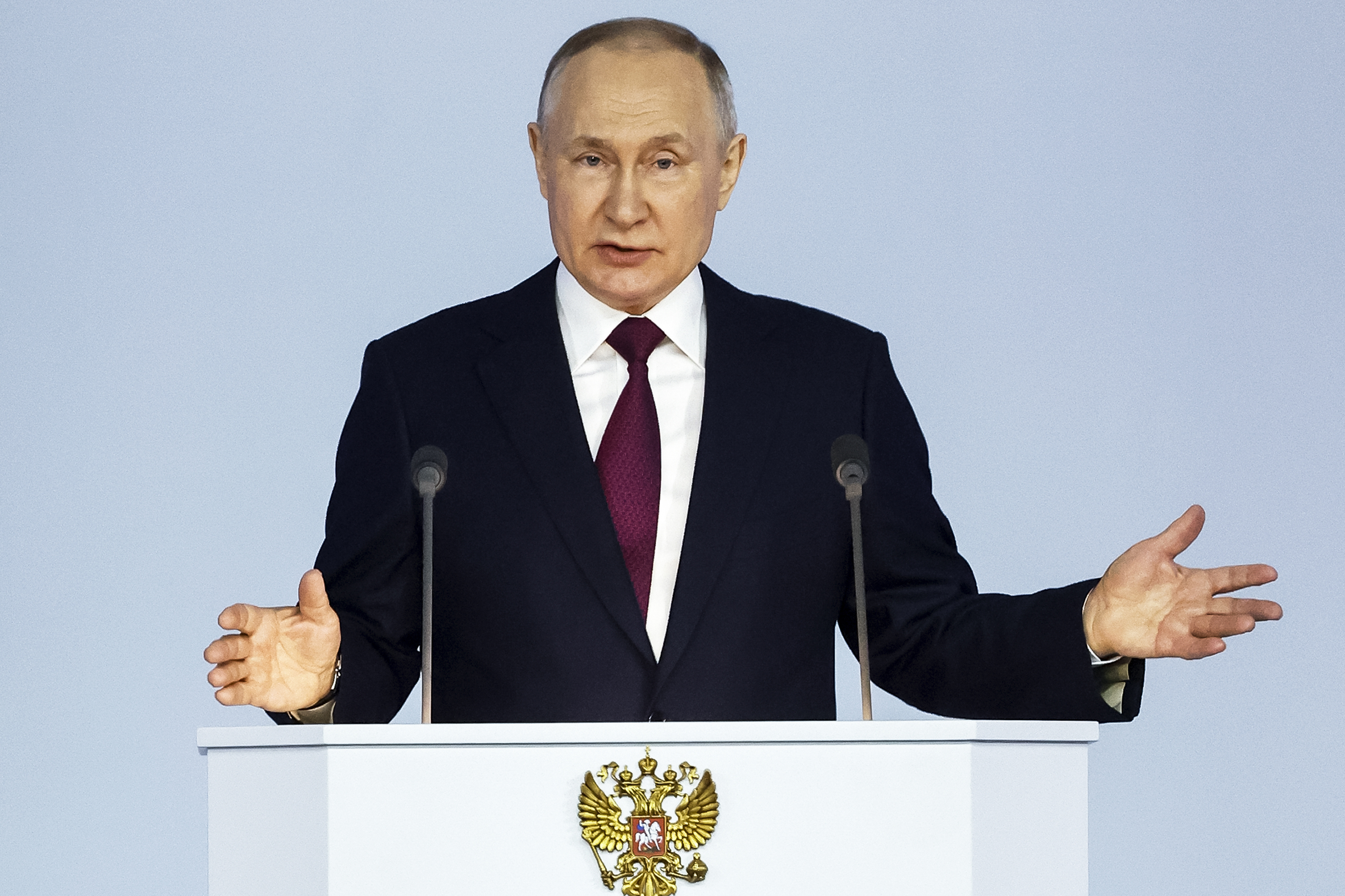 Russian President Vladimir Putin gestures as he gives his annual state of the nation address in Moscow, Russia, Tuesday, Feb. 21, 2023 