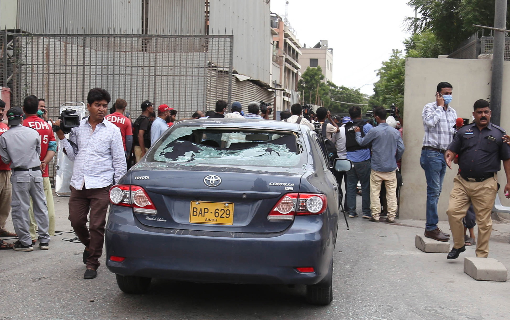 Pakistani security officials inspect the scene of an attack by unknown gunmen at Karachi Stock Exchange in Karachi, Pakistan, 29 June 2020. At least four gunmen and two civilians were reportedly killed and security forces have cordoned off the area as fighting is currently ongoing