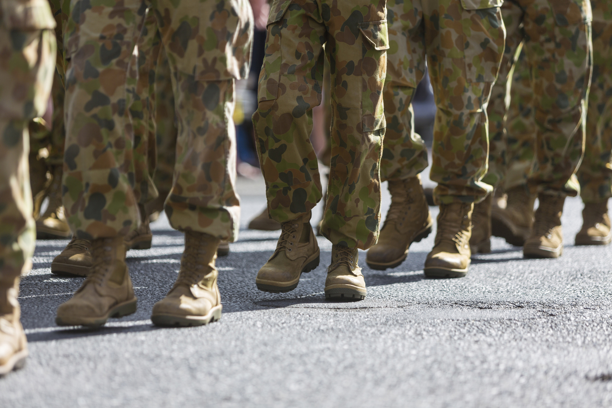 Feet of soldiers marching at an ANZAC Day parade on the streets of a regional country town