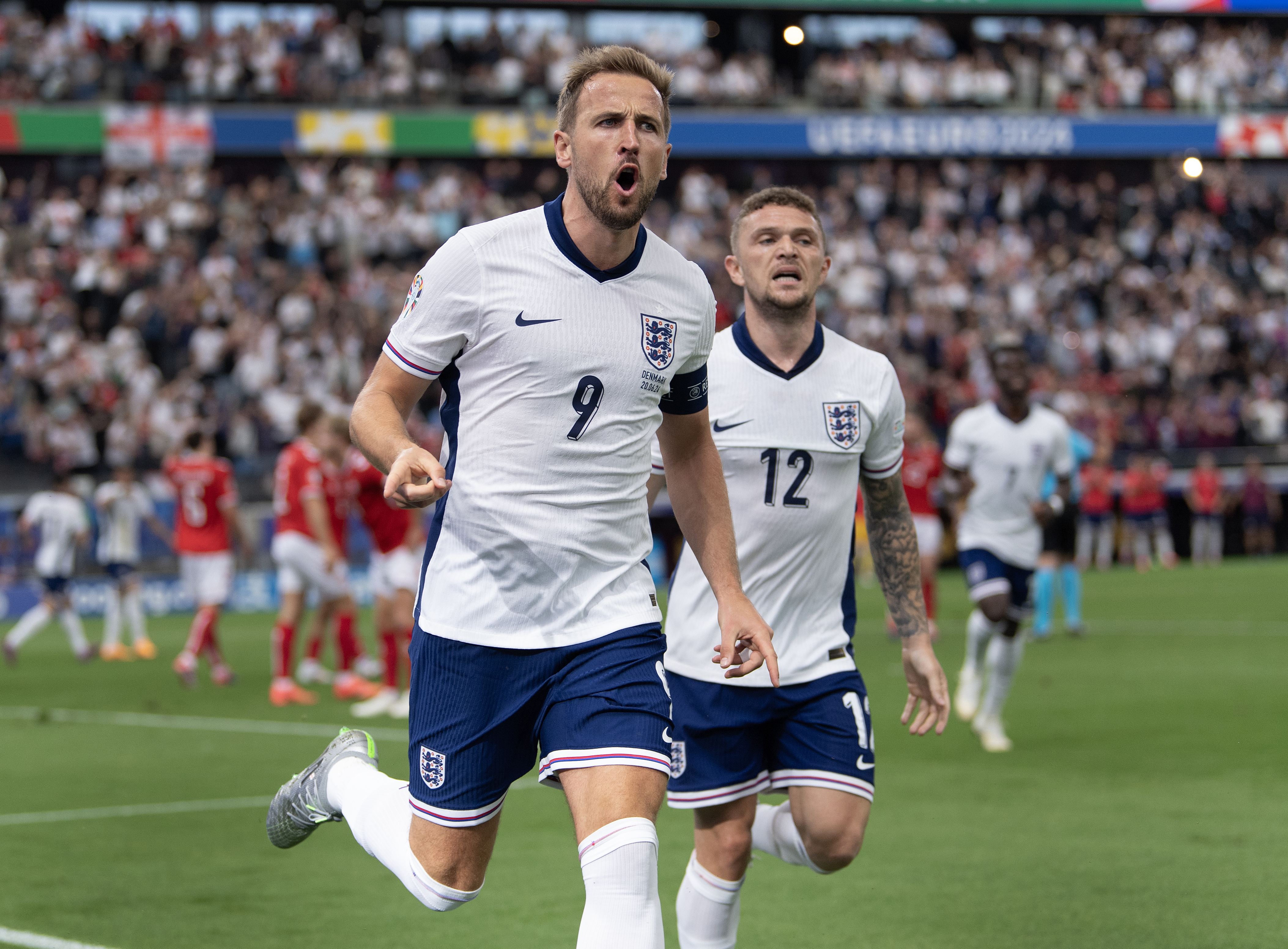 Harry Kane of England celebrates scoring with Kieran Trippier during the UEFA EURO 2024 group stage match between Denmark and England at Frankfurt Arena on June 20, 2024 in Frankfurt am Main, Germany. (Photo by Visionhaus/Getty Images)