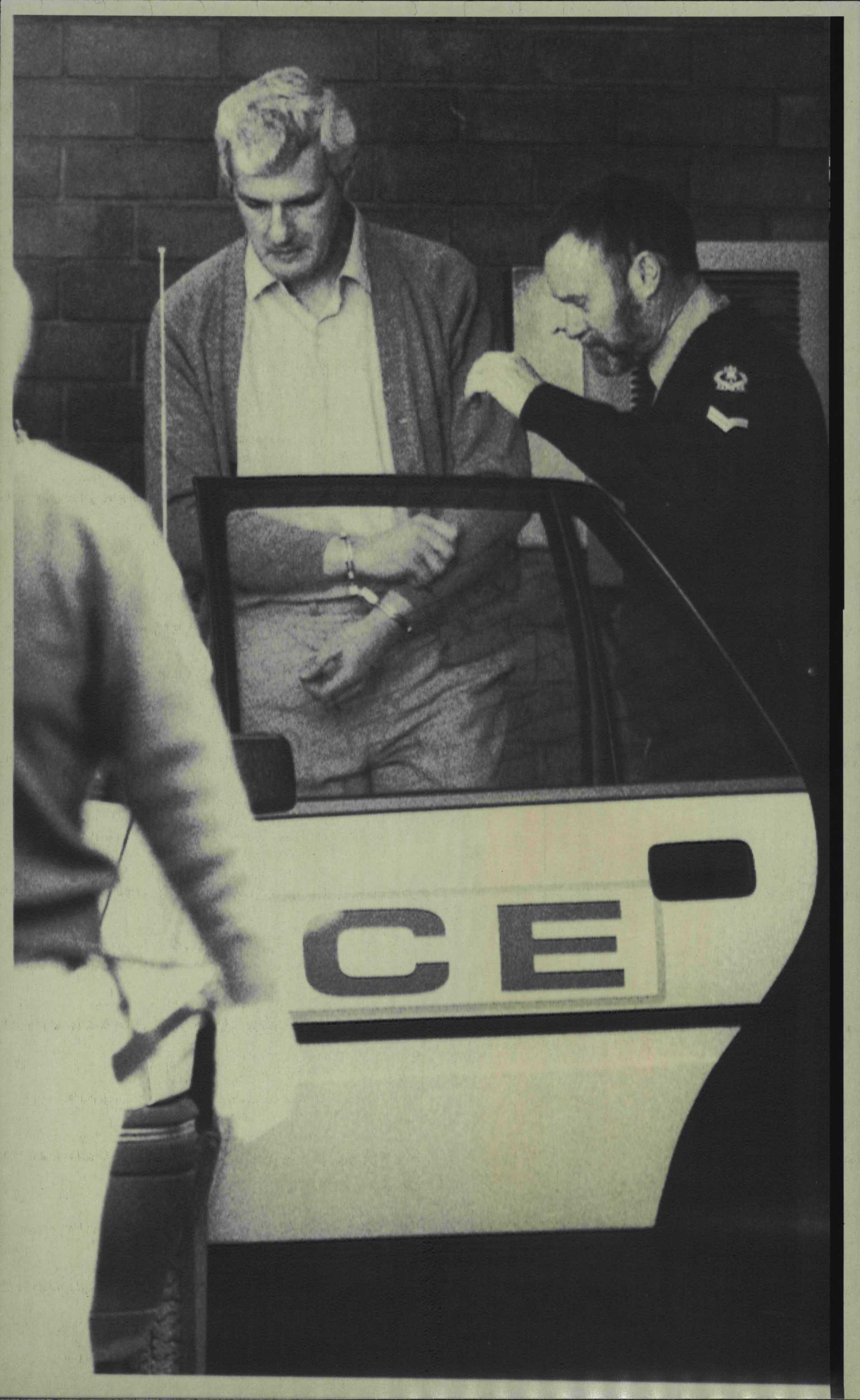 Bevan Spencer Von Einem being escorted from Adelaide Magistrates Court.