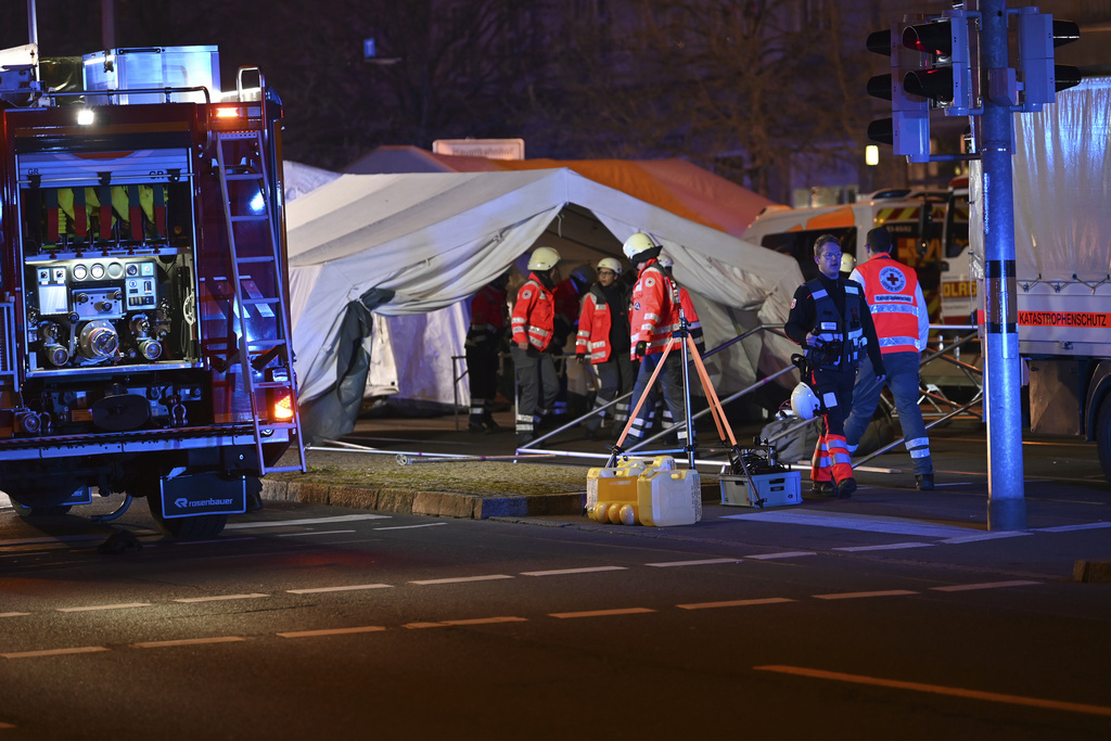 Emergency services attend an incident at the Christmas market in Magdeburg, Germany, Friday Dec. 20, 2024. (Heiko Rebsch/dpa via AP)