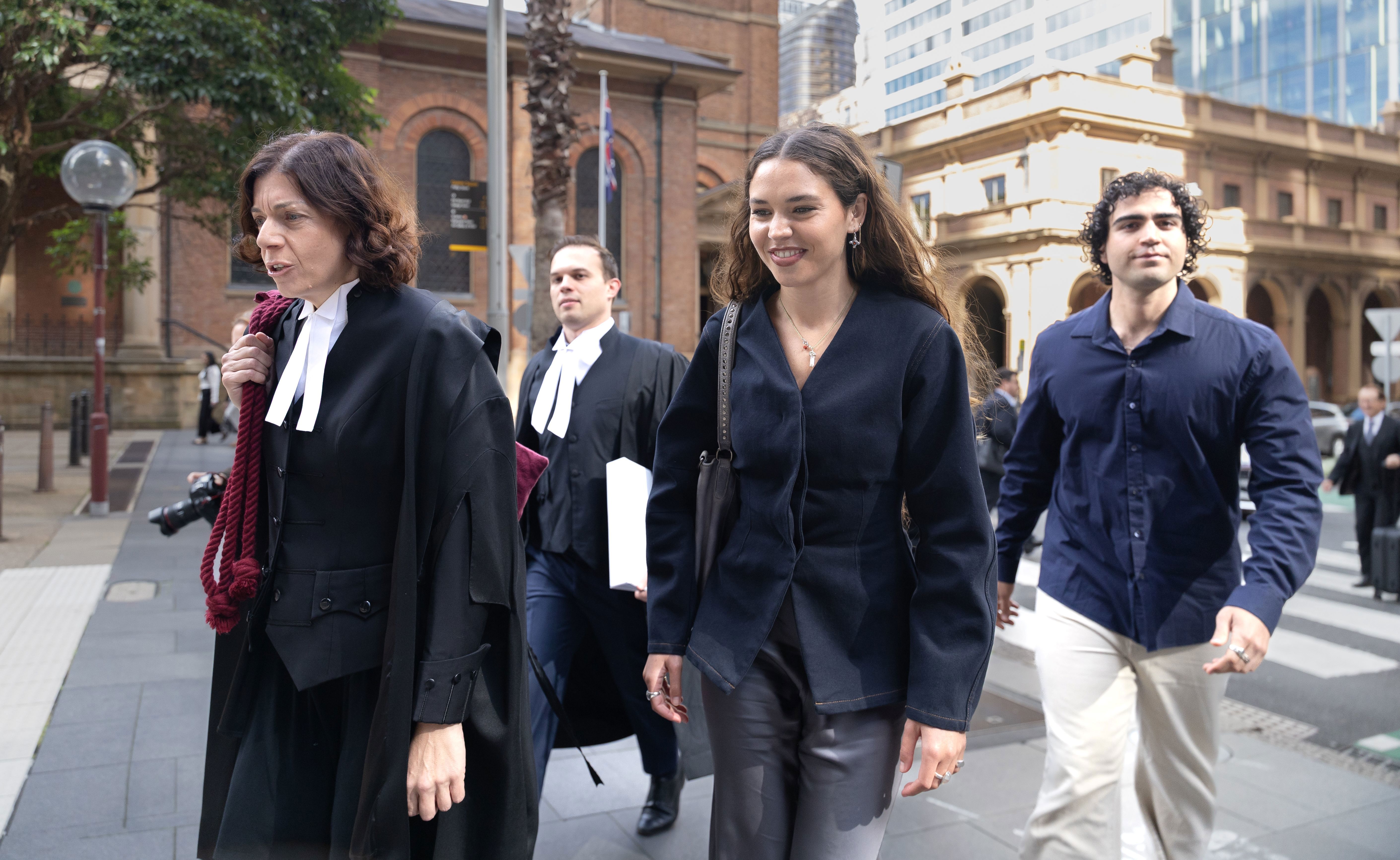 Charlotte MacInnes arrives at the Federal Court in Sydney on Monday morning. She is suing Rebel Wilson, the director of the film The Deb, for defamation. Monday 20th April 2026.