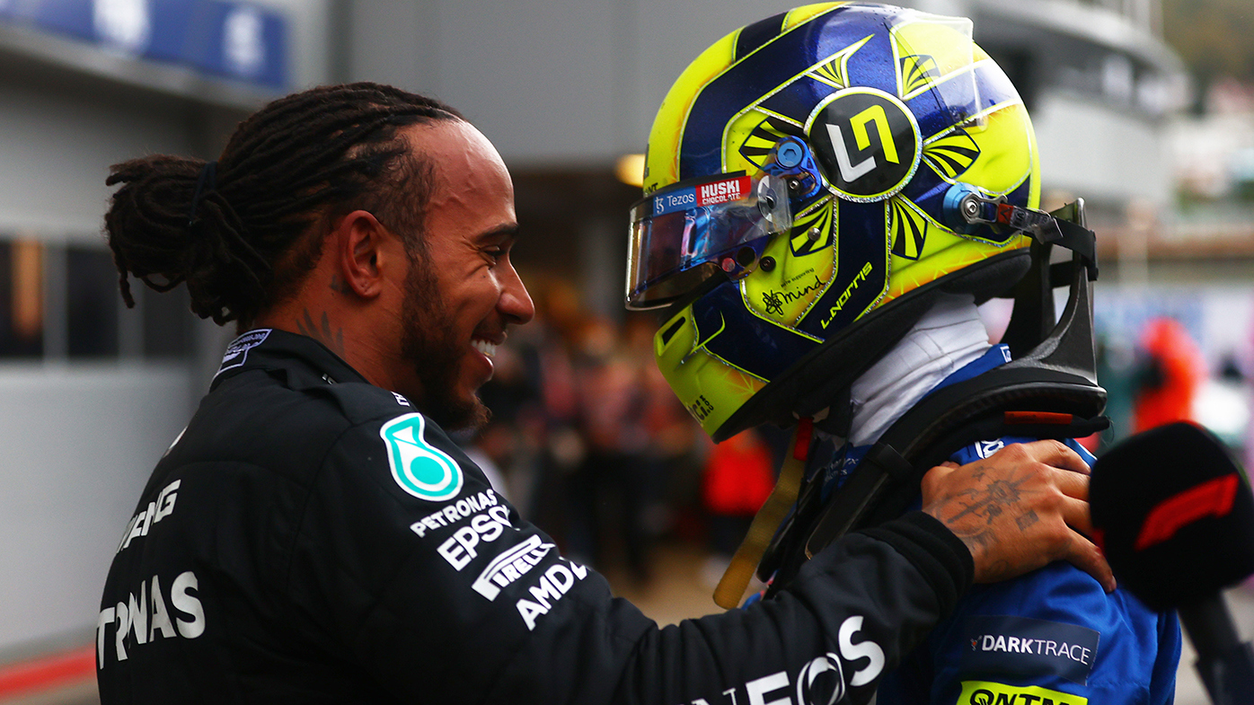 Lando Norris congratulates Lewis Hamilton after the Mercedes driver won the Russian Grand Prix.