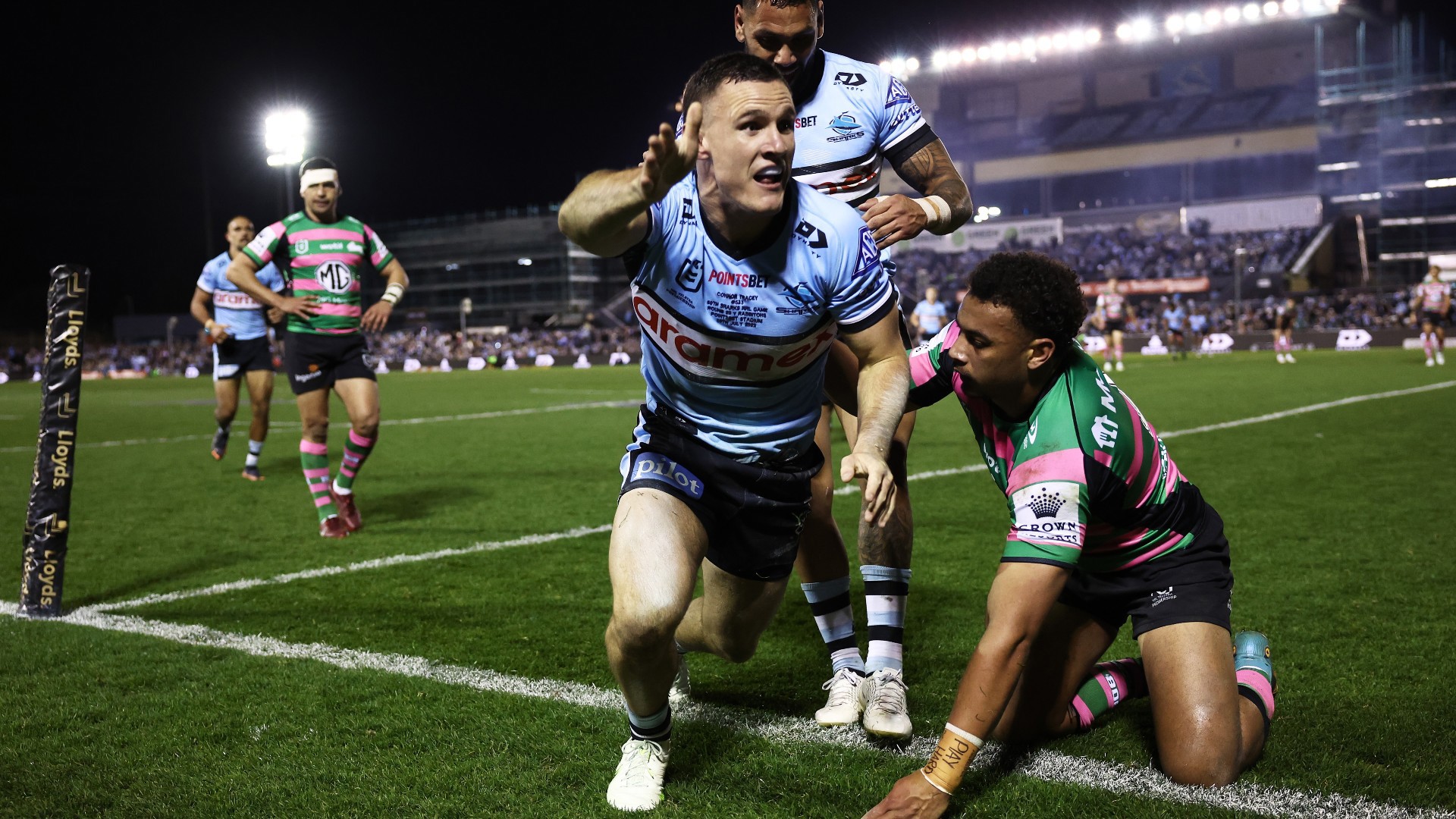 Connor Tracey of the Sharks celebrates scoring a try during the round 20 NRL match between the Cronulla Sharks and the South Sydney Rabbitohs at PointsBet Stadium