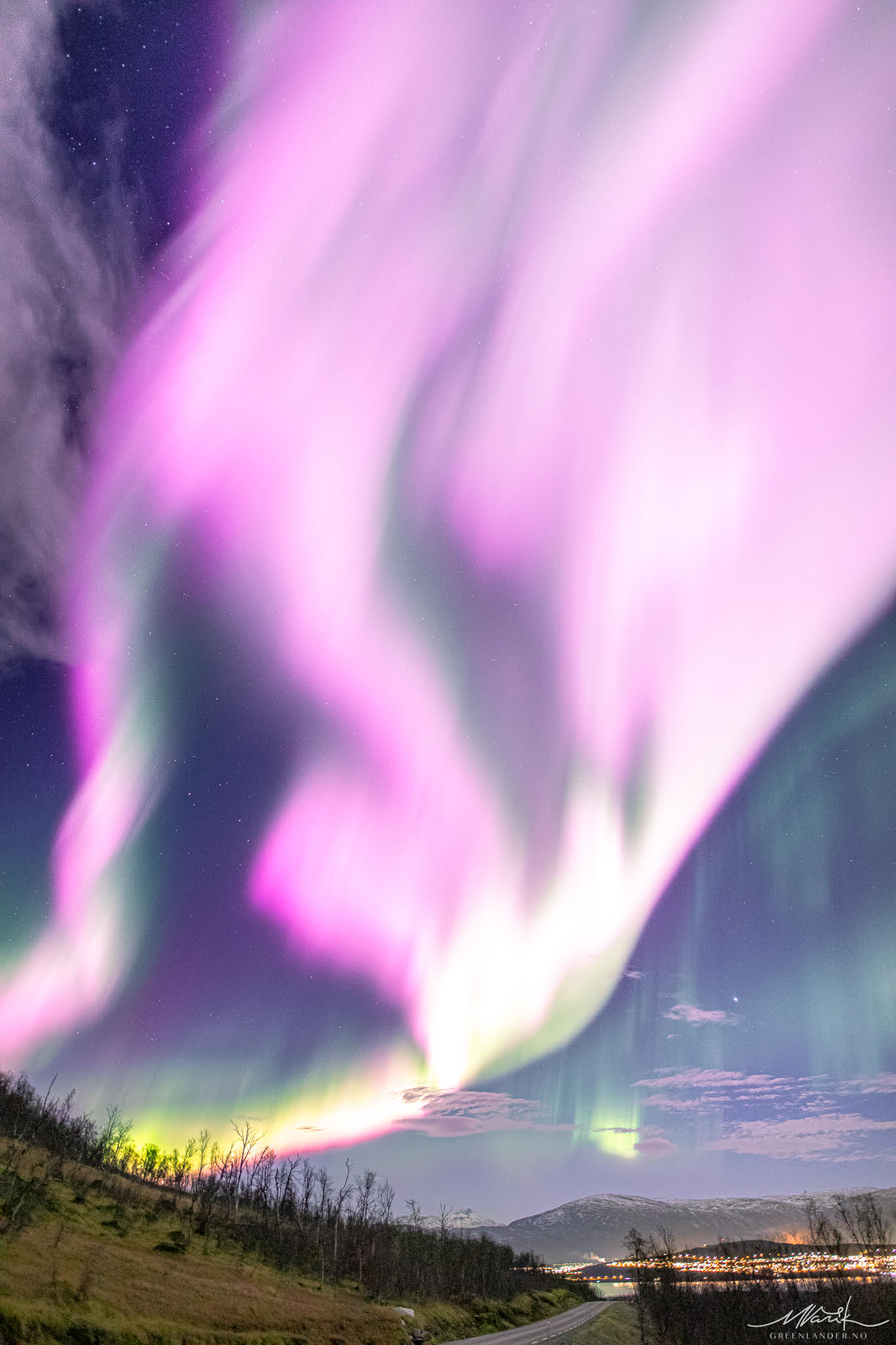 The sky above Norway dazzled with vibrant pinks and purples after a solar storm tore temporary holes in Earth's magnetic field. 