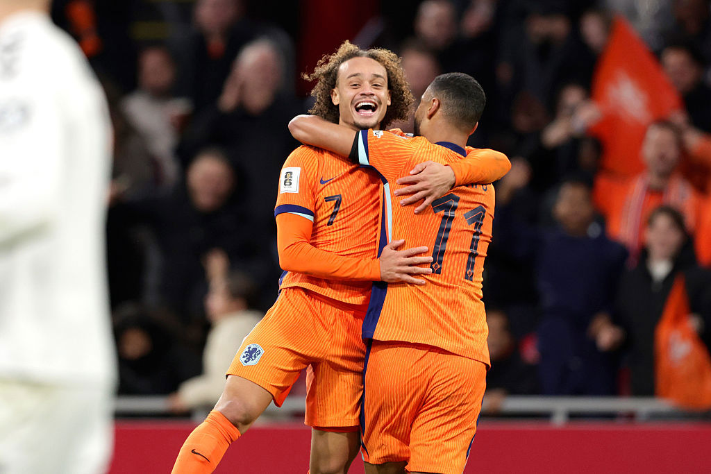 Xavi Simons of Holland celebrates 3-0 with Cody Gakpo.