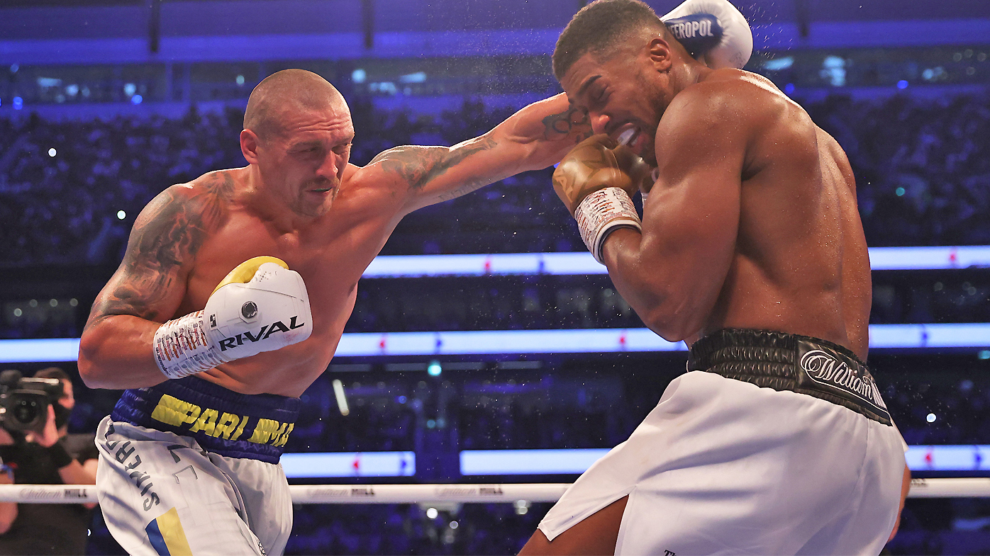 Oleksandr Usyk punches as Anthony Joshua