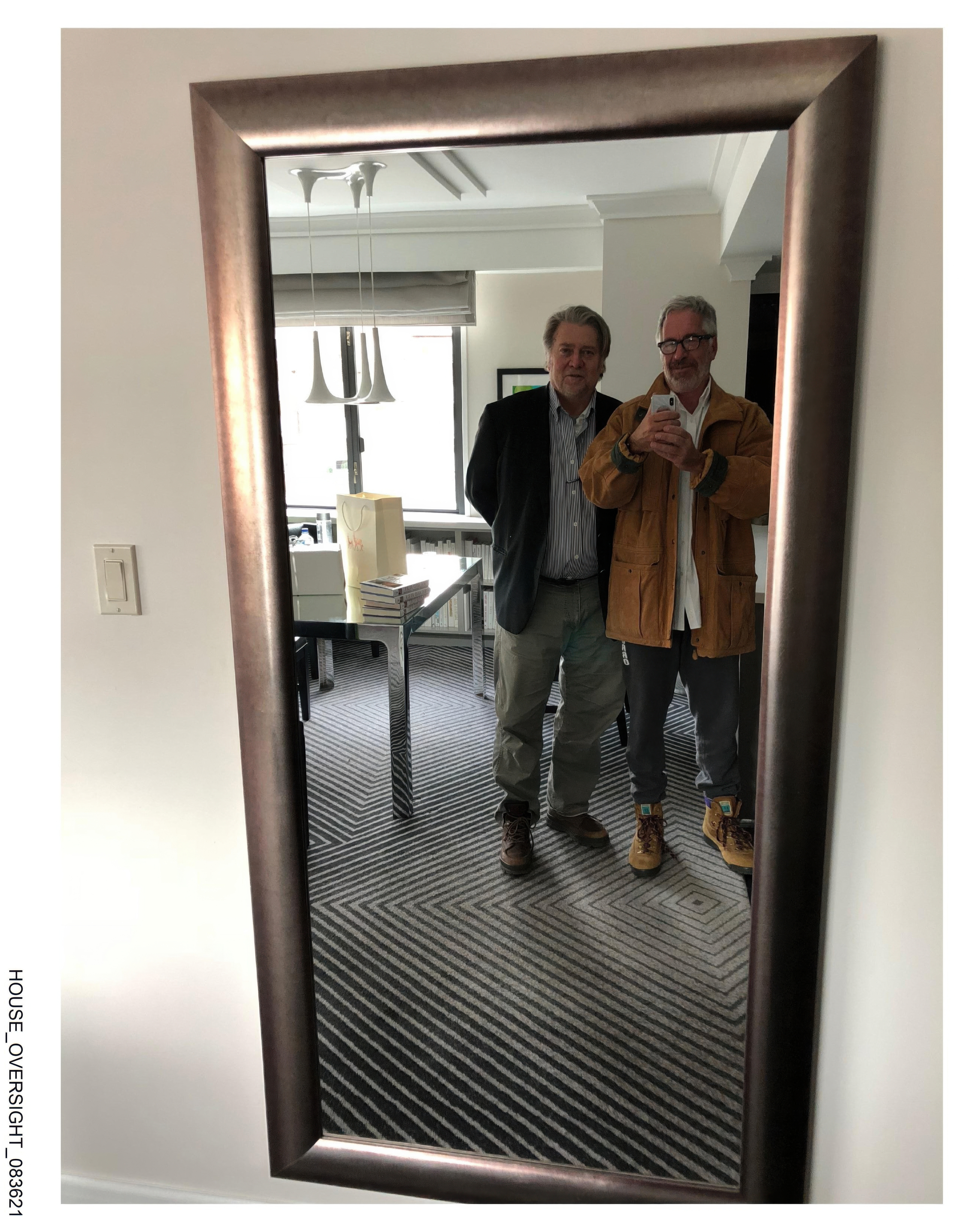 This undated photo released by Democrats on the House Oversight Committee shows Steve Bannon and Jeffrey Epstein taking a photo together. 