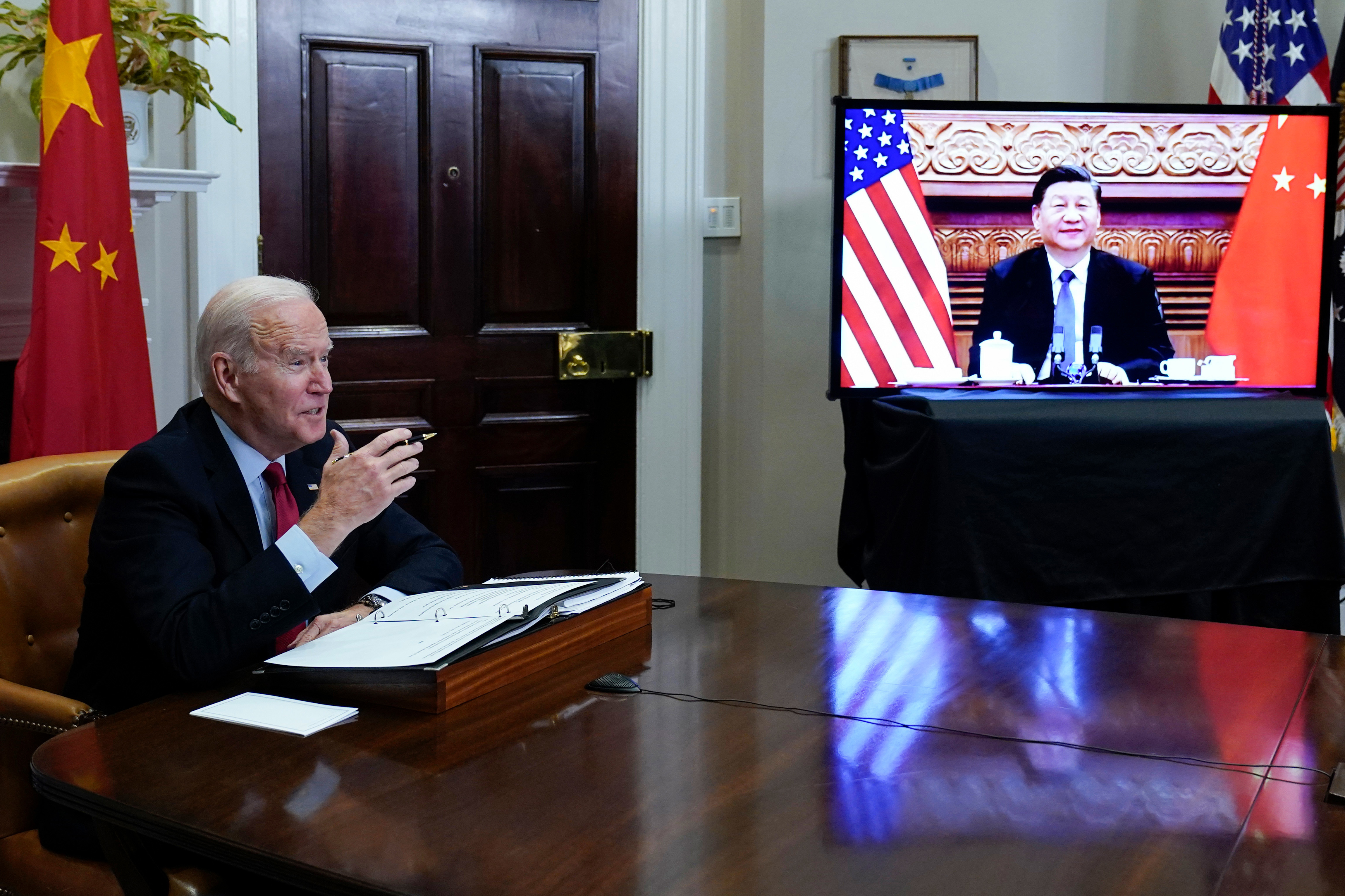 President Joe Biden meets virtually with Chinese President Xi Jinping