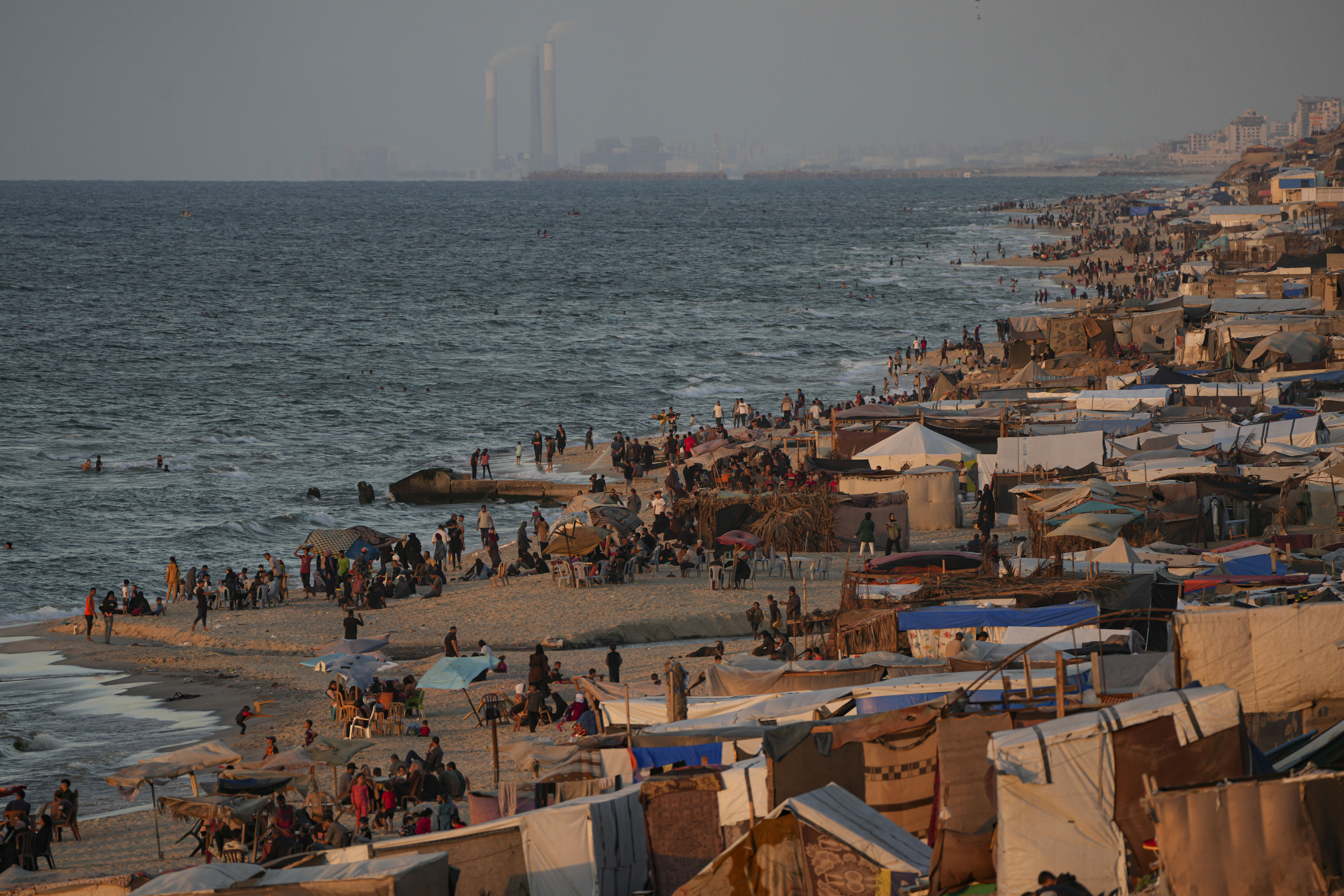 Tents are crammed together as displaced Palestinians camp along the beach of Deir al-Balah, central Gaza Strip, Wednesday, Oct. 9, 2024. (AP Photo/Abdel Kareem Hana)