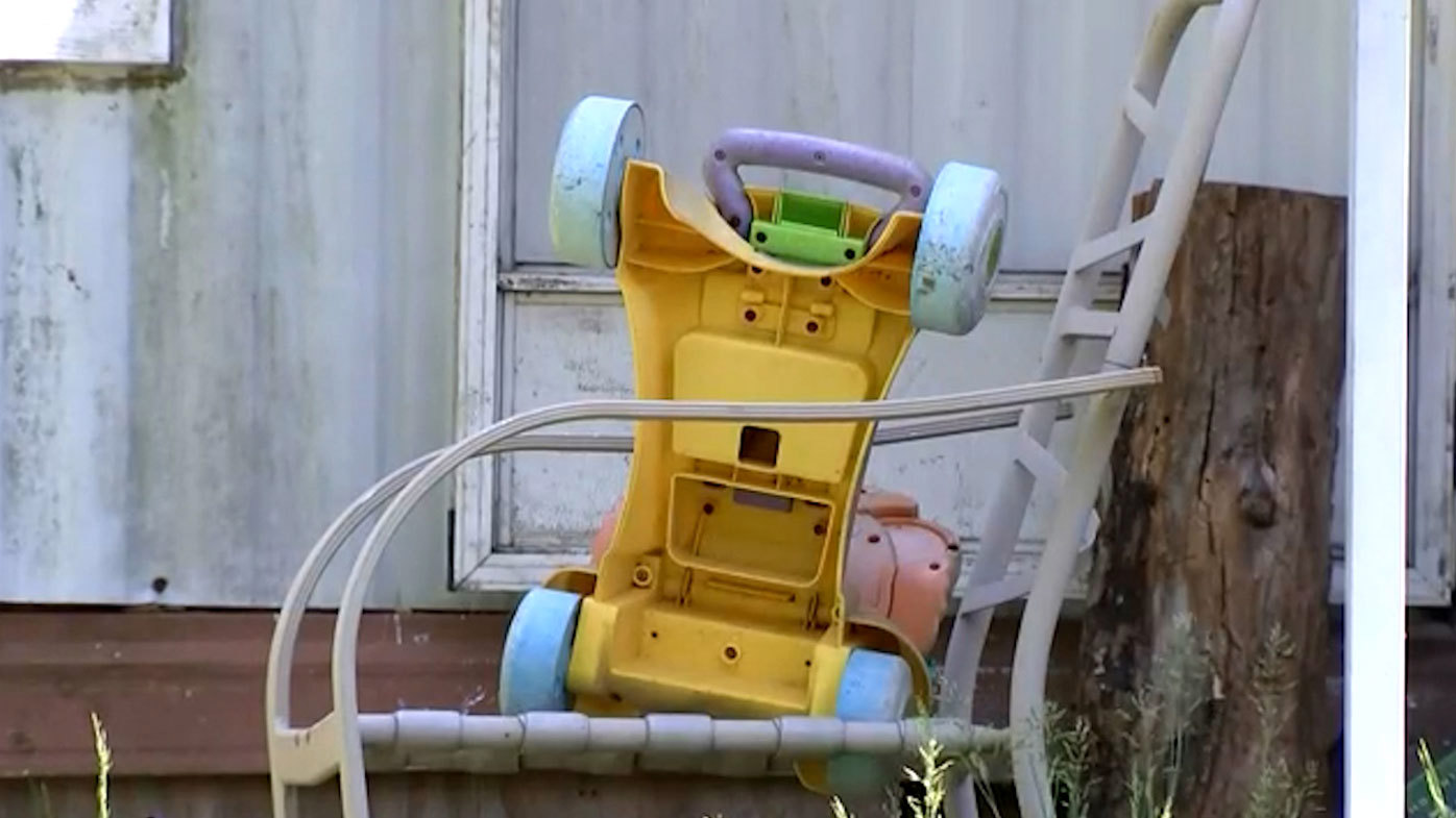 Police found four children hidden in a back room and found a padlock-secured refrigerator with very little food.