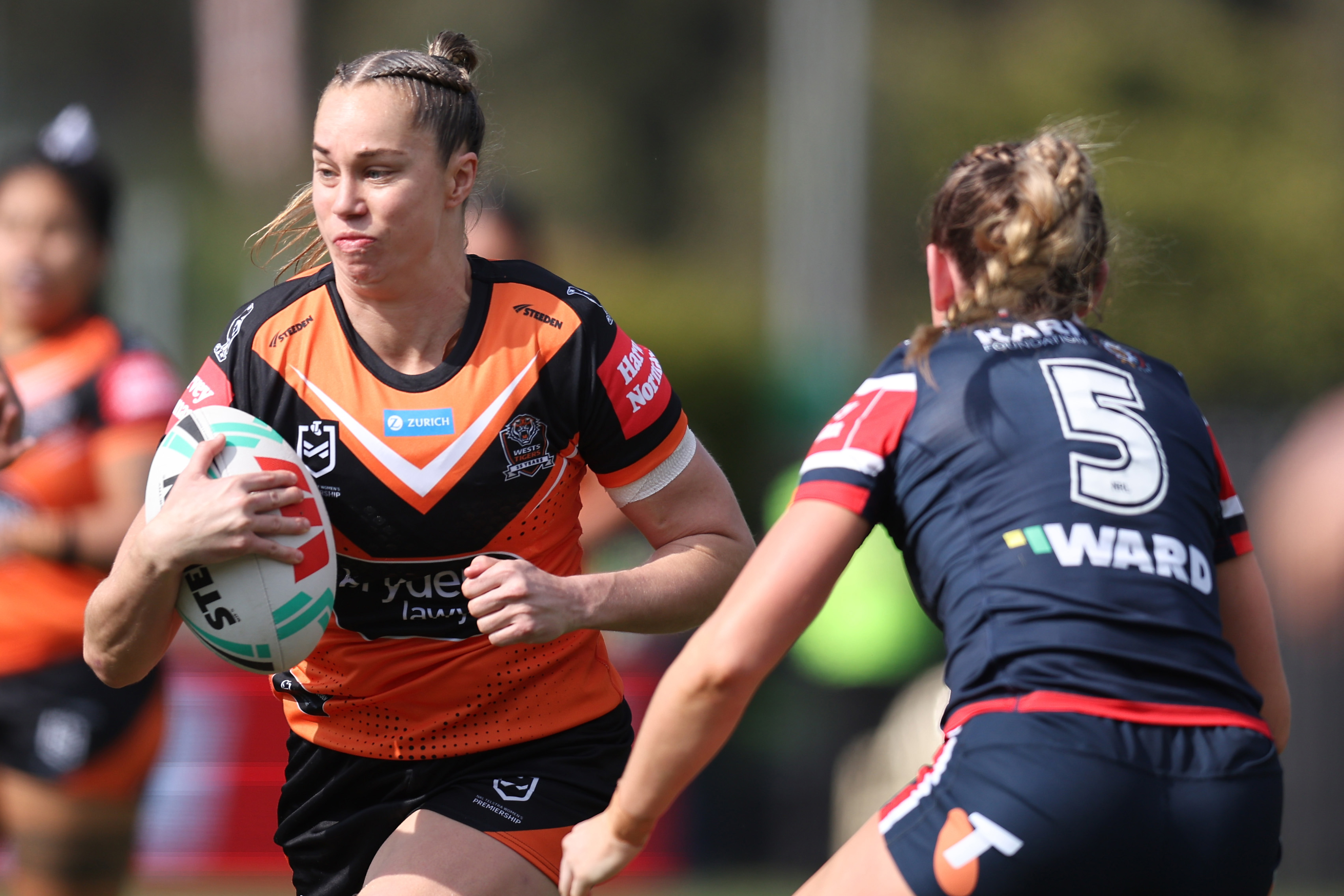 Kezie Apps of the Wests Tigers runs with the ball.