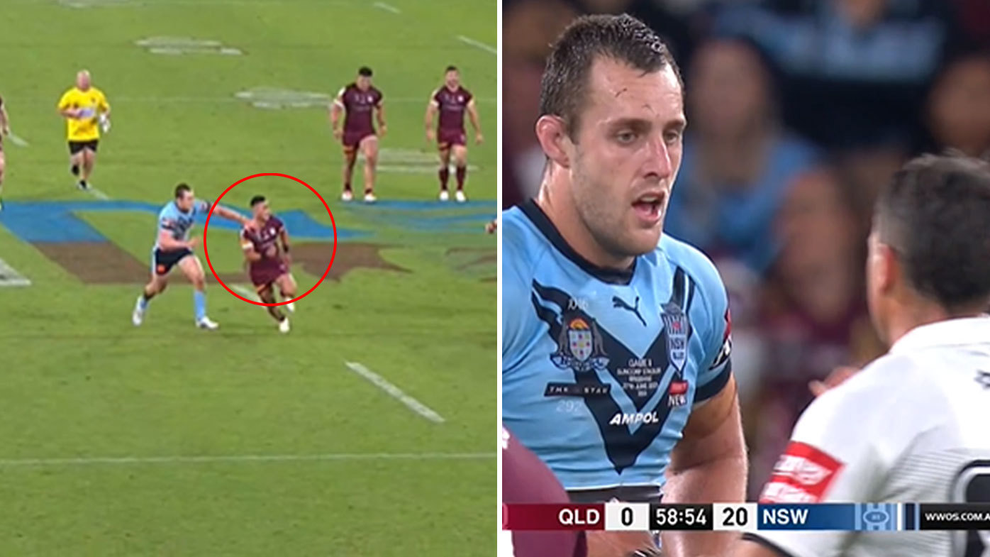 Isaah Yeo holds on to Valentine Holmes