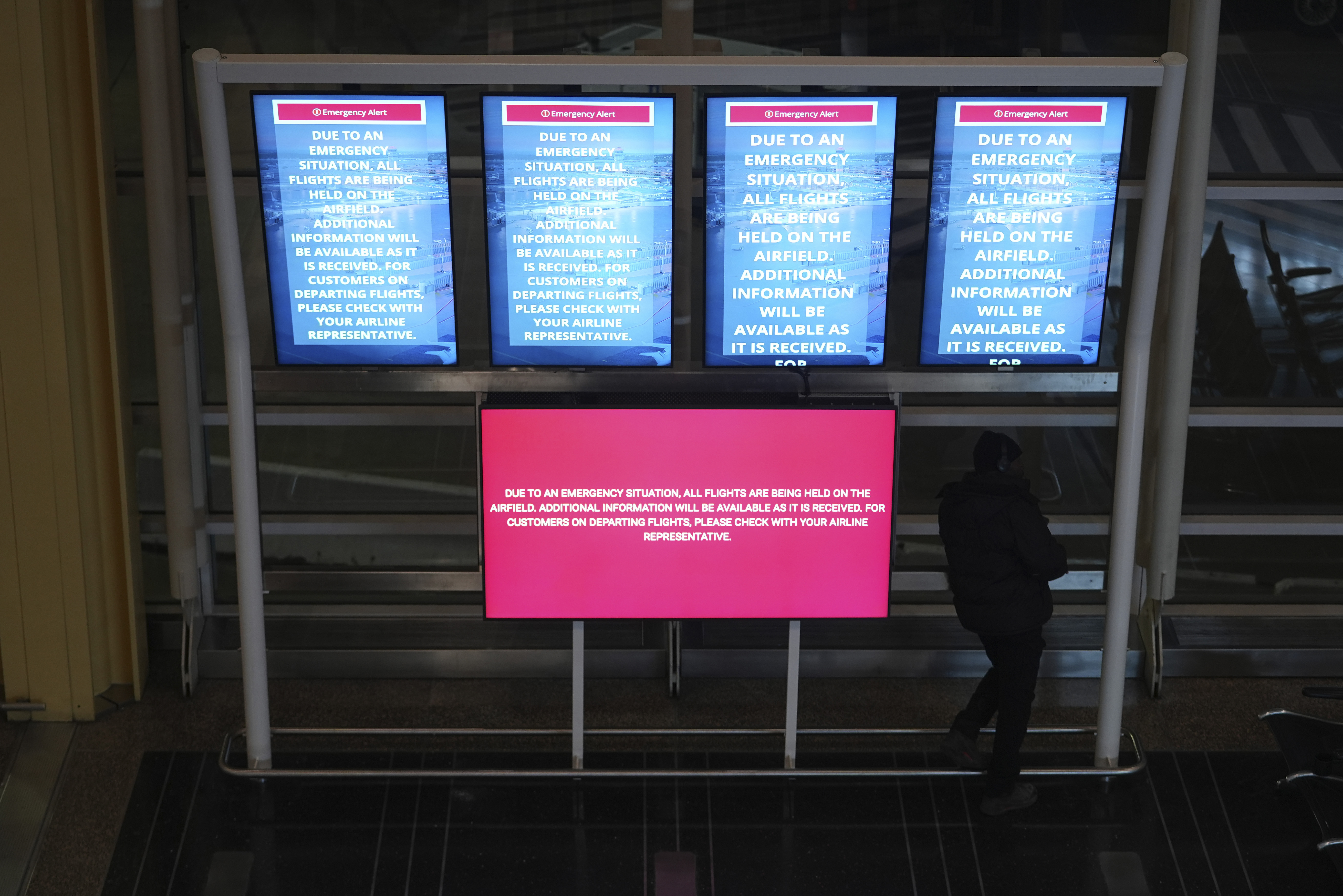 A information board displays a message at Ronald Reagan Washington National Airport, Wednesday, Jan. 29, 2025, in Arlington, Va. (AP Photo/Julio Cortez)