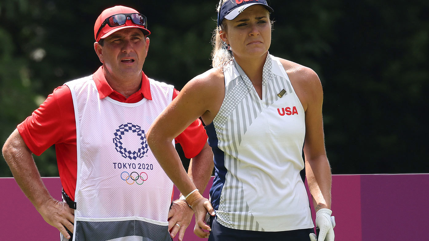 Lexi Thompson of Team United States and and caddie Jack Fulghum, before Fulghum was replaced late in the first round of the Tokyo Olympics.