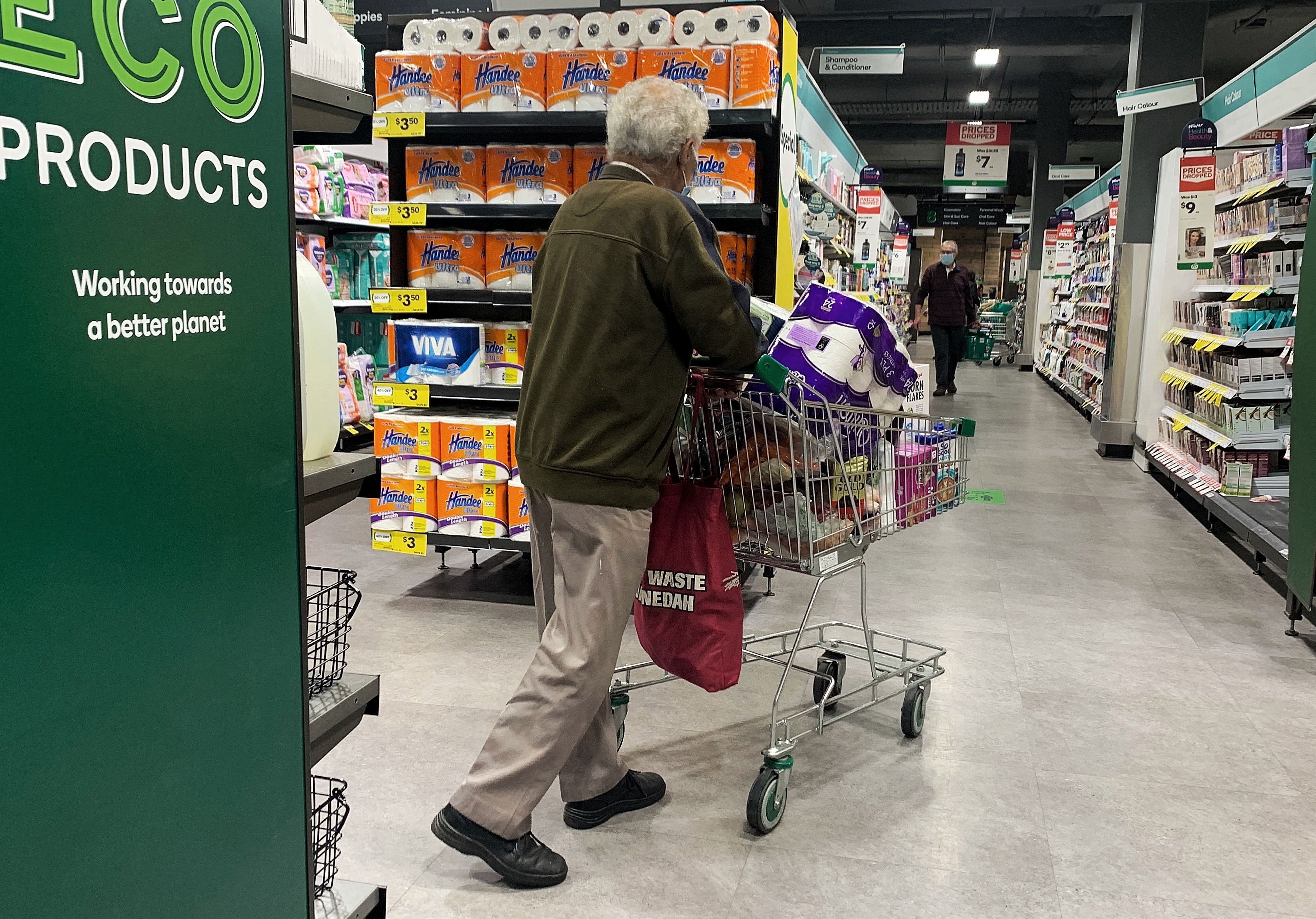 Toilet paper in a shopping trolley in a Woolworths supermarket in Sydney.