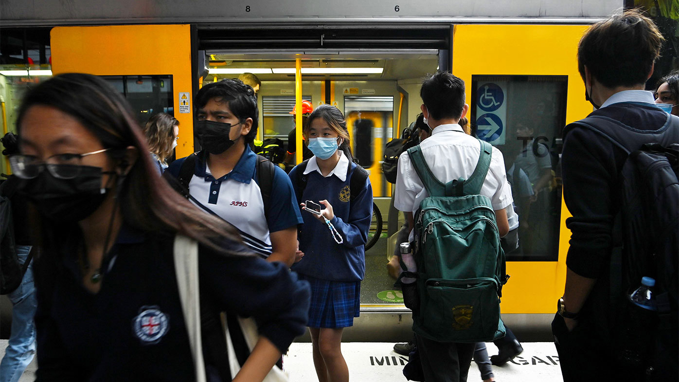 Commuters disembark from a Sydney train.