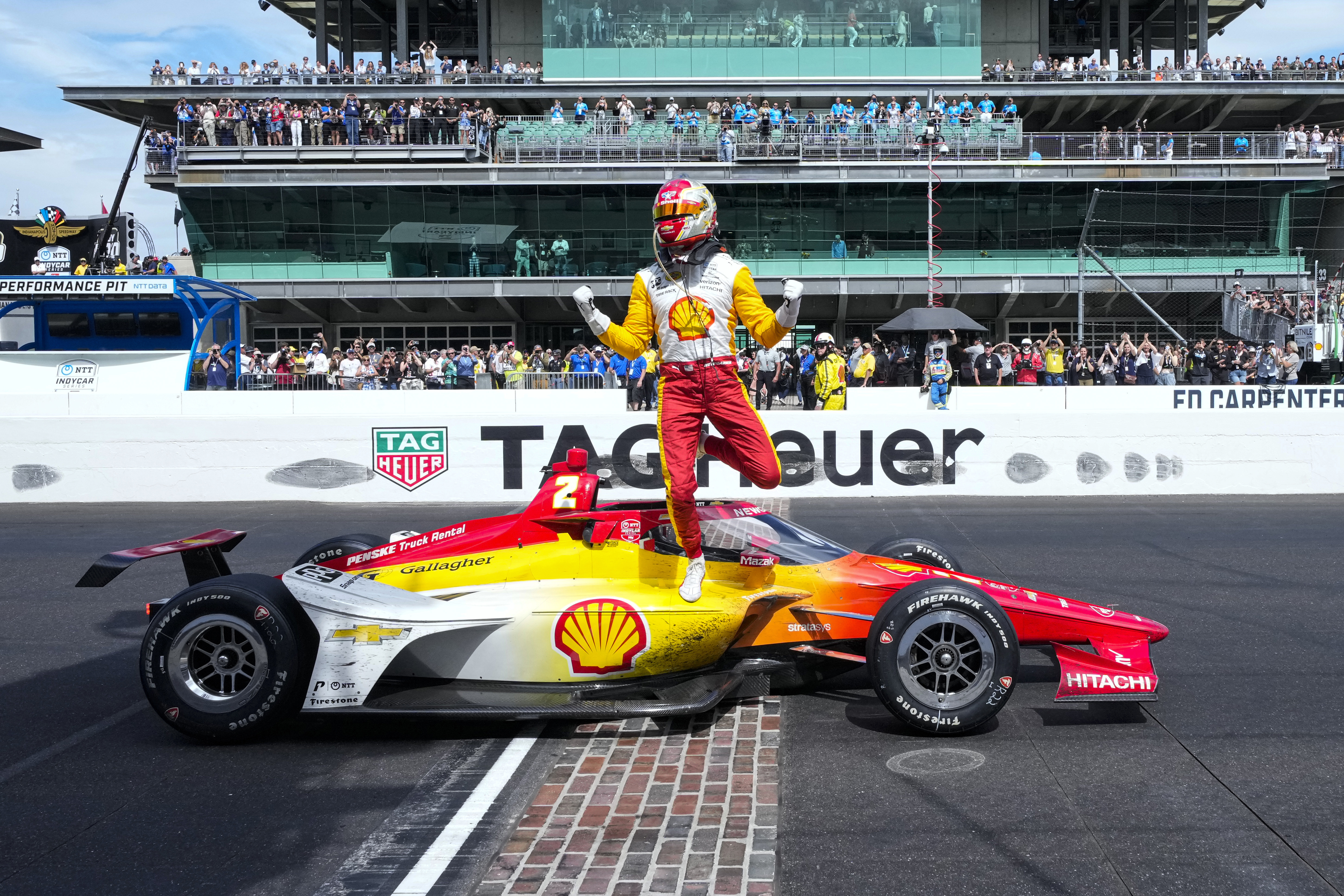 Josef Newgarden celebrates on the finish line after winning the Indianapolis 500.