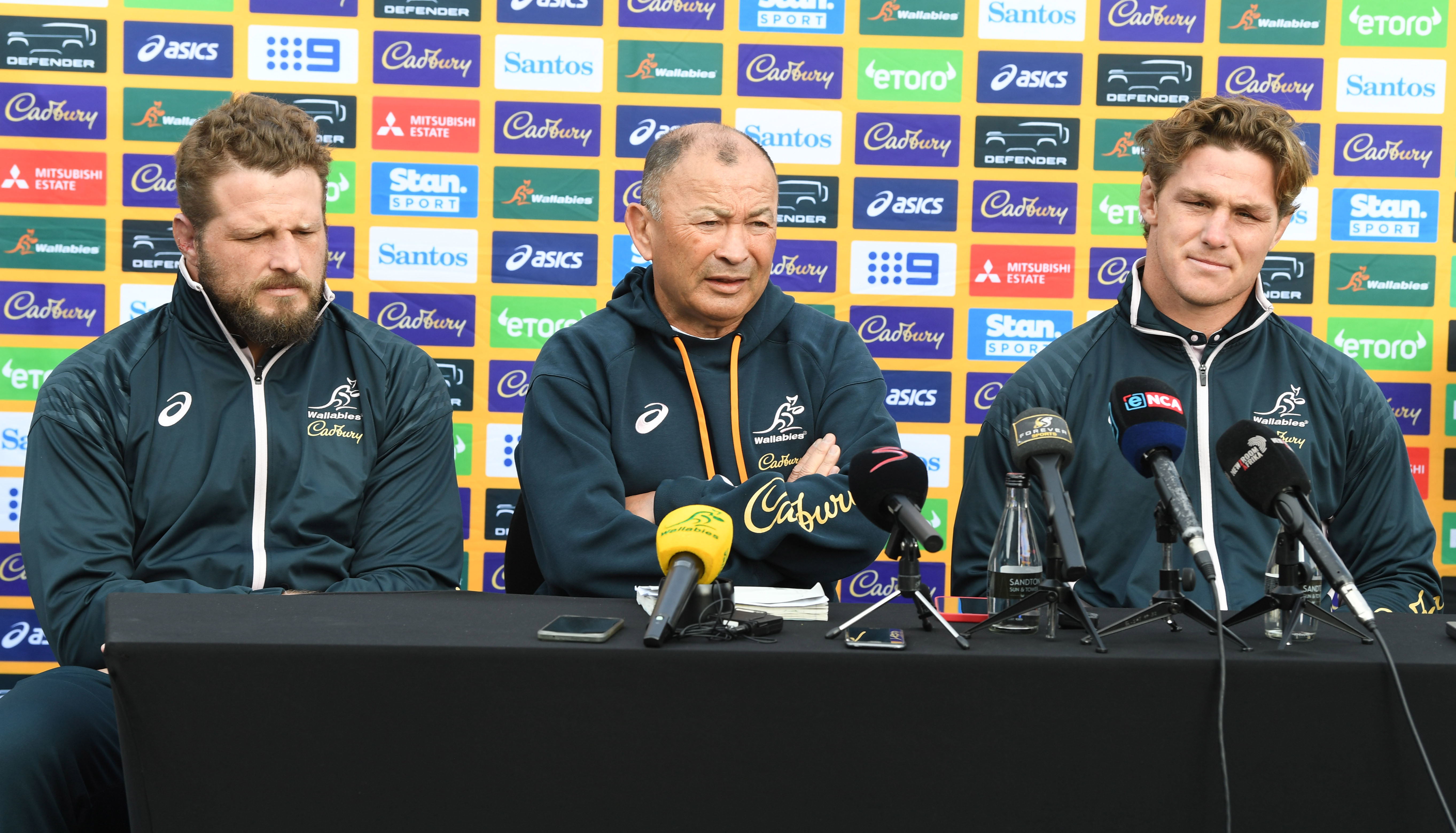 James Slipper (from left), Eddie Jones, and Michael Hooper during the Australia men's national rugby team announcement in Johannesburg.