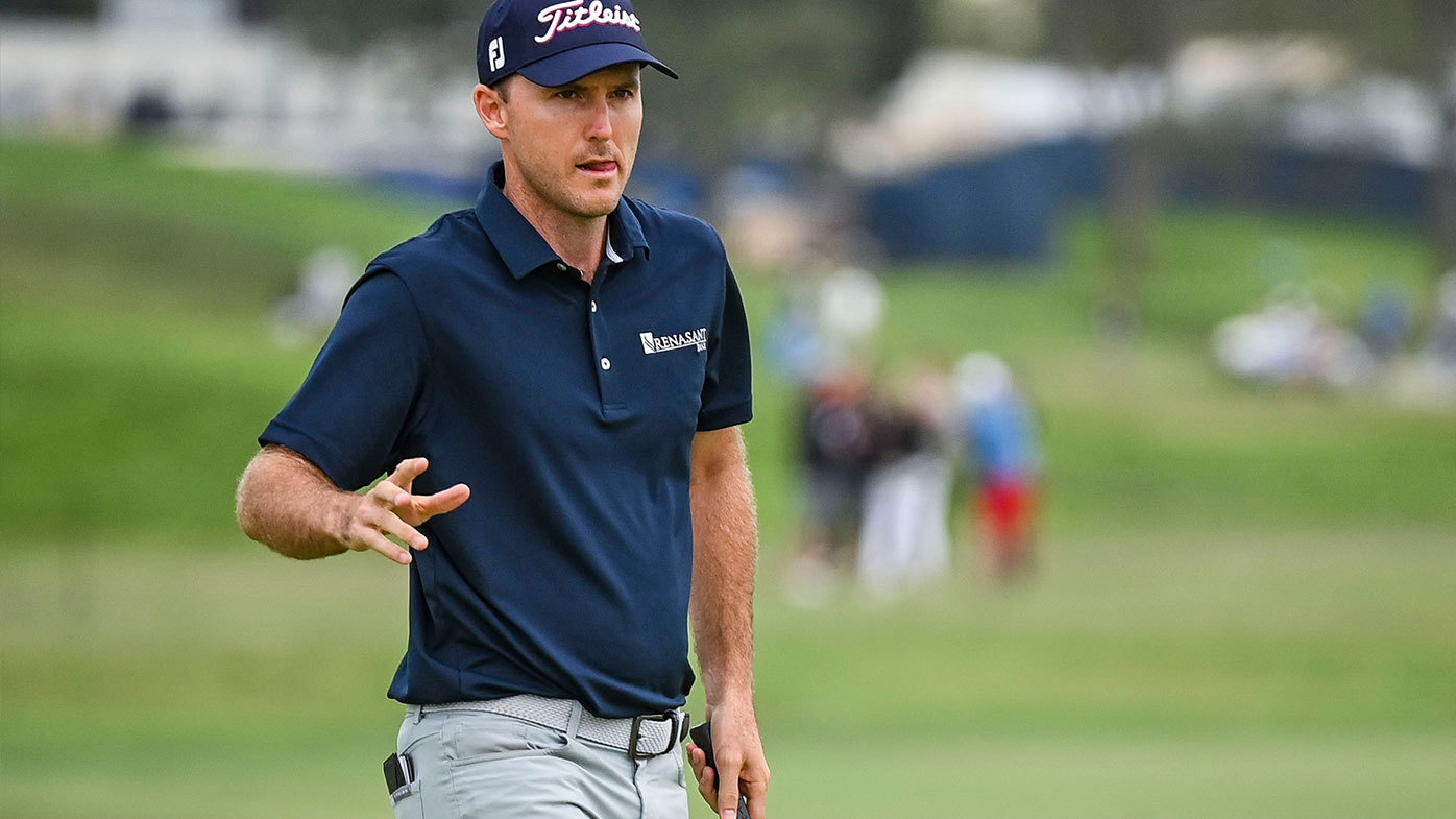 Russell Henley waves to fans after making a par putt on the sixth hole green during the second round of the 121st U.S. Open on the South Course at Torrey Pines Golf Course on June 18, 2021 in La Jolla, San Diego, California. (Photo by Keyur Khamar/PGA TOUR via Getty Images)