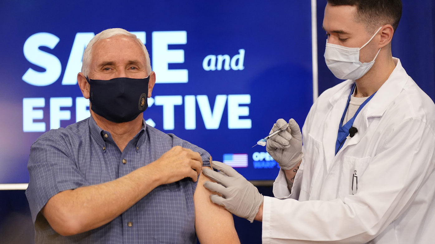 Vice President Mike Pence receives a Pfizer-BioNTech COVID-19 vaccine shot at the Eisenhower Executive Office Building on the White House complex, Friday, Dec. 18, 2020, in Washington