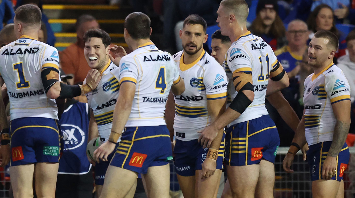 Mitchell Moses is congratulated by Eels players during their round 17 loss to the Knights.