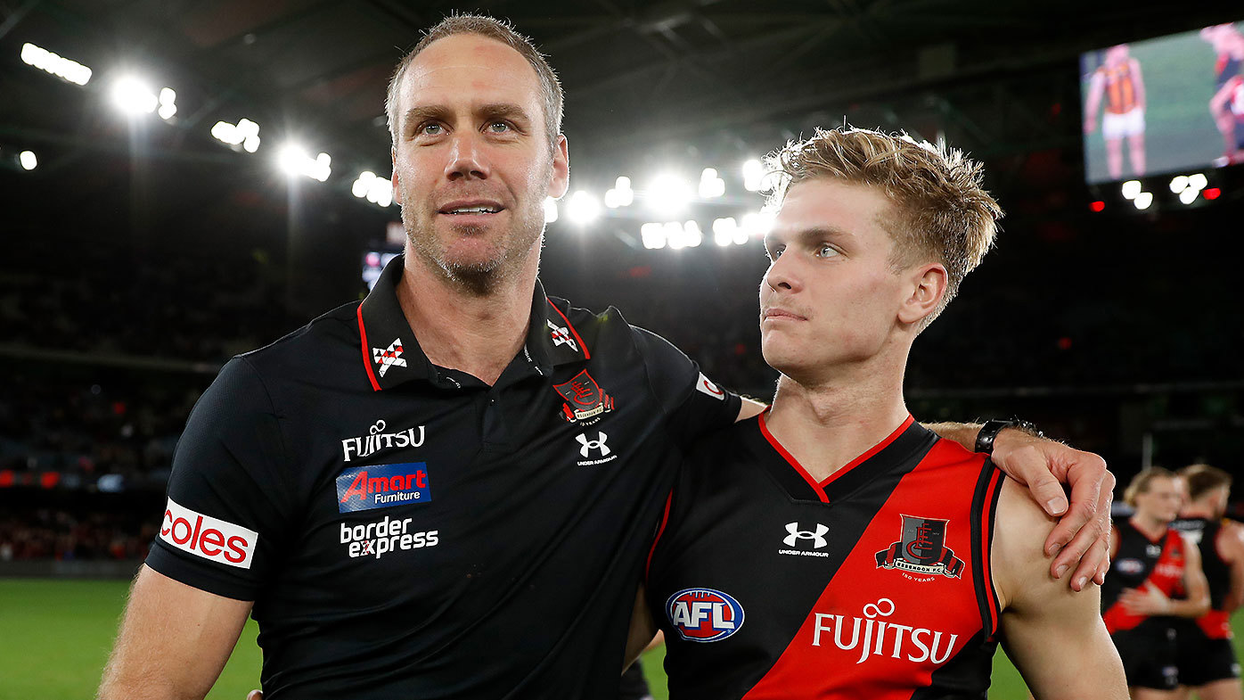 Former Essendon coach Ben Rutten pictured with youngster Ben Hobbs