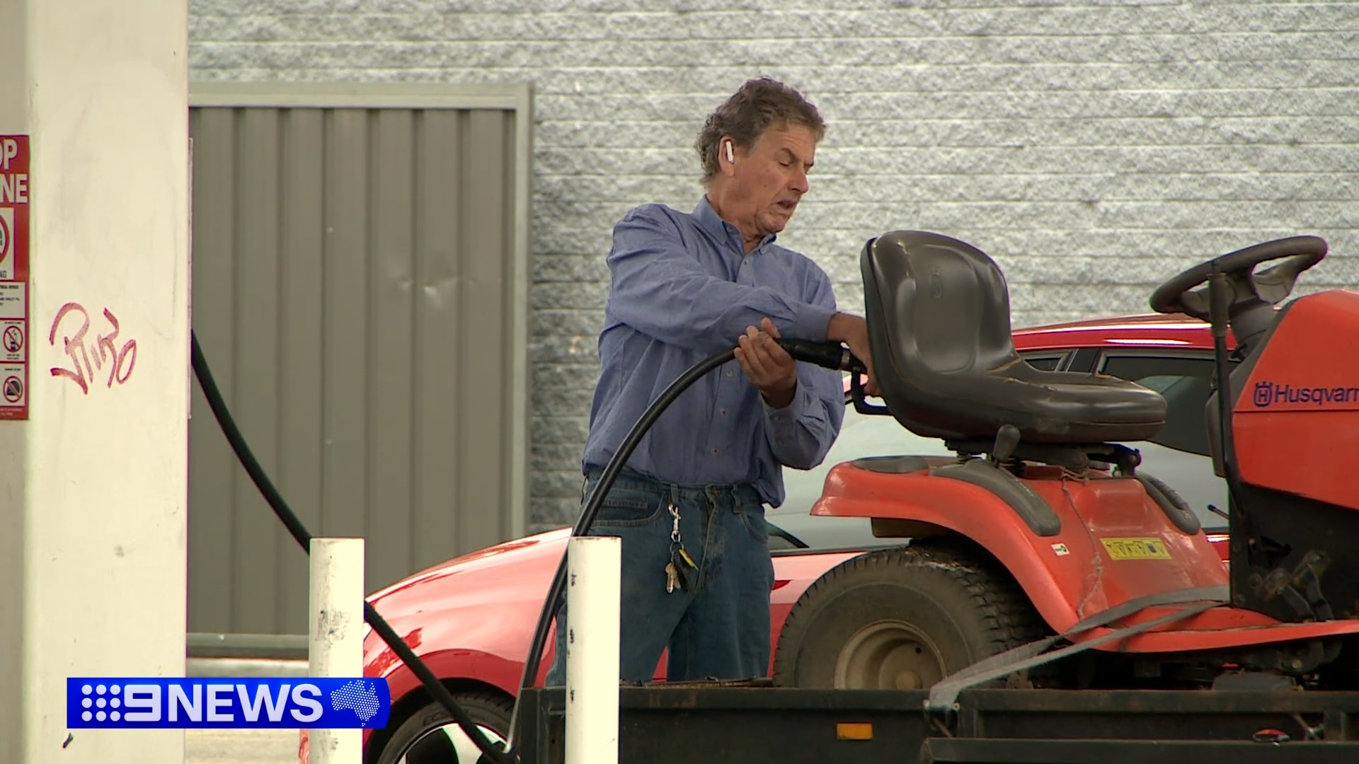 Man filling up tractor