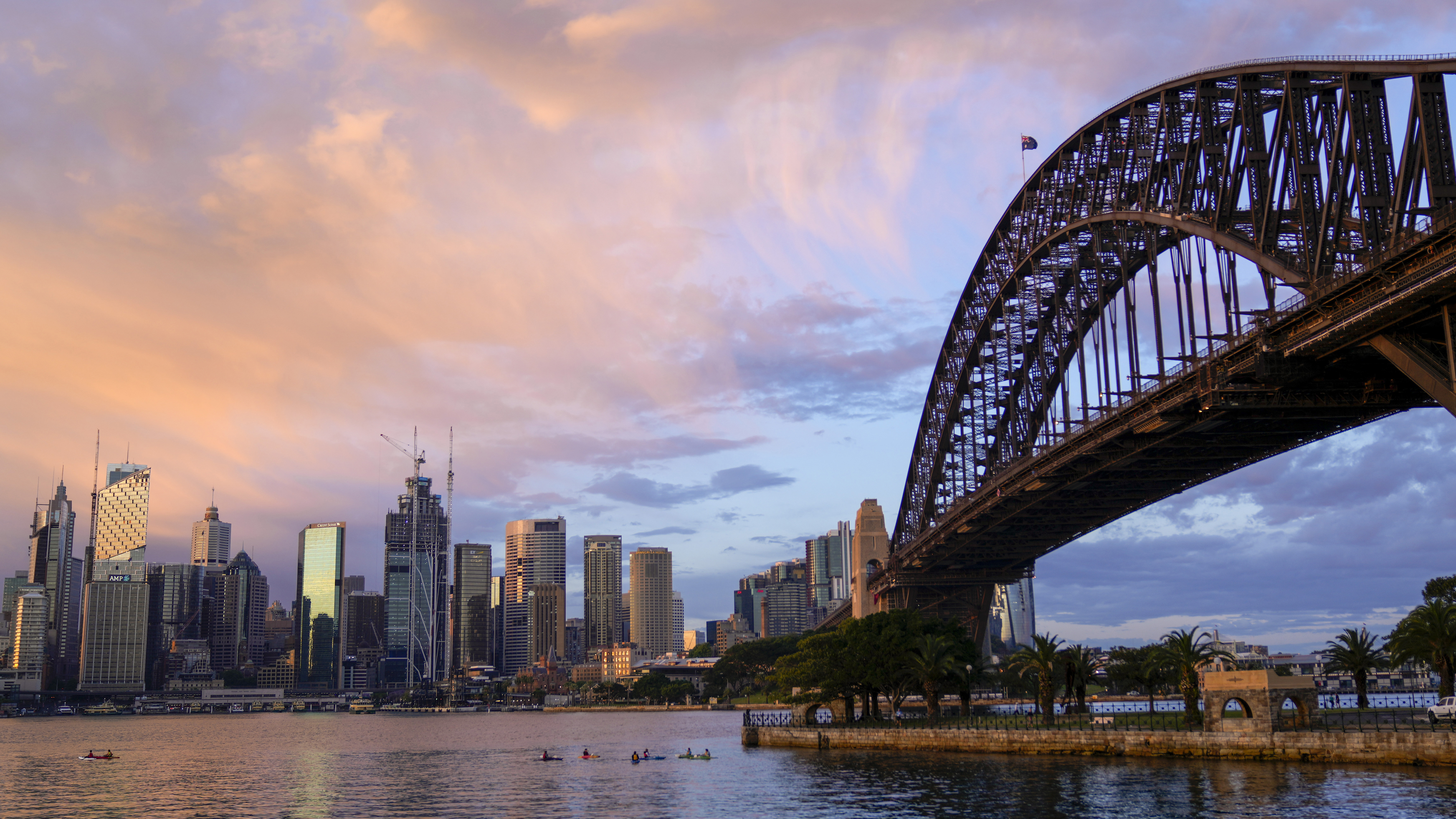 The sun rises over the Sydney skyline.